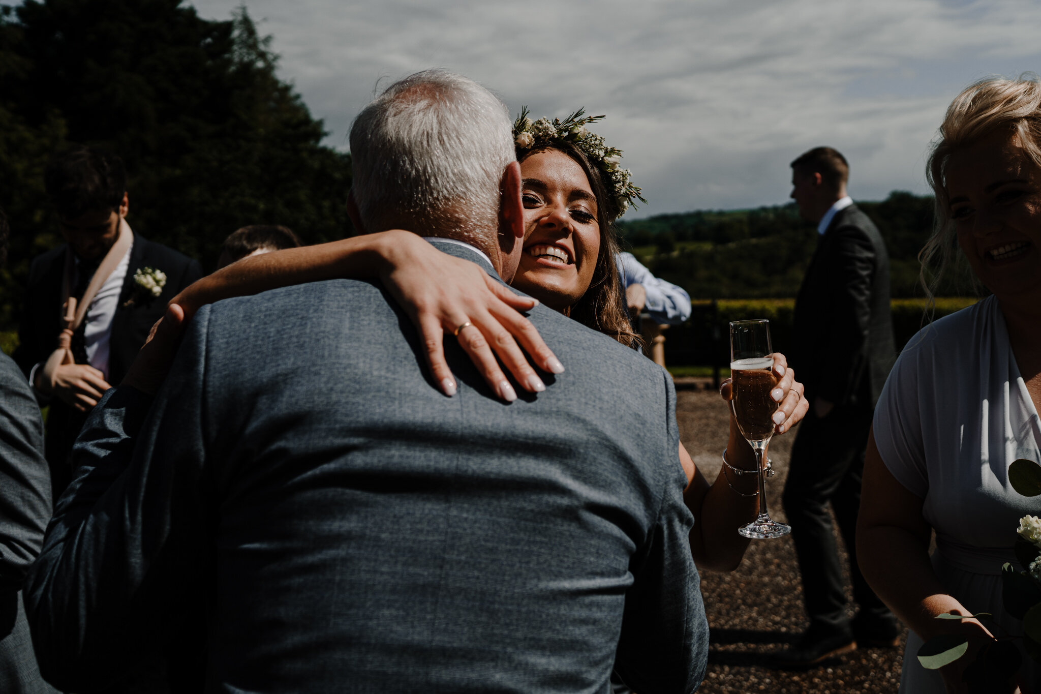 just-married-hugs-bride-guests