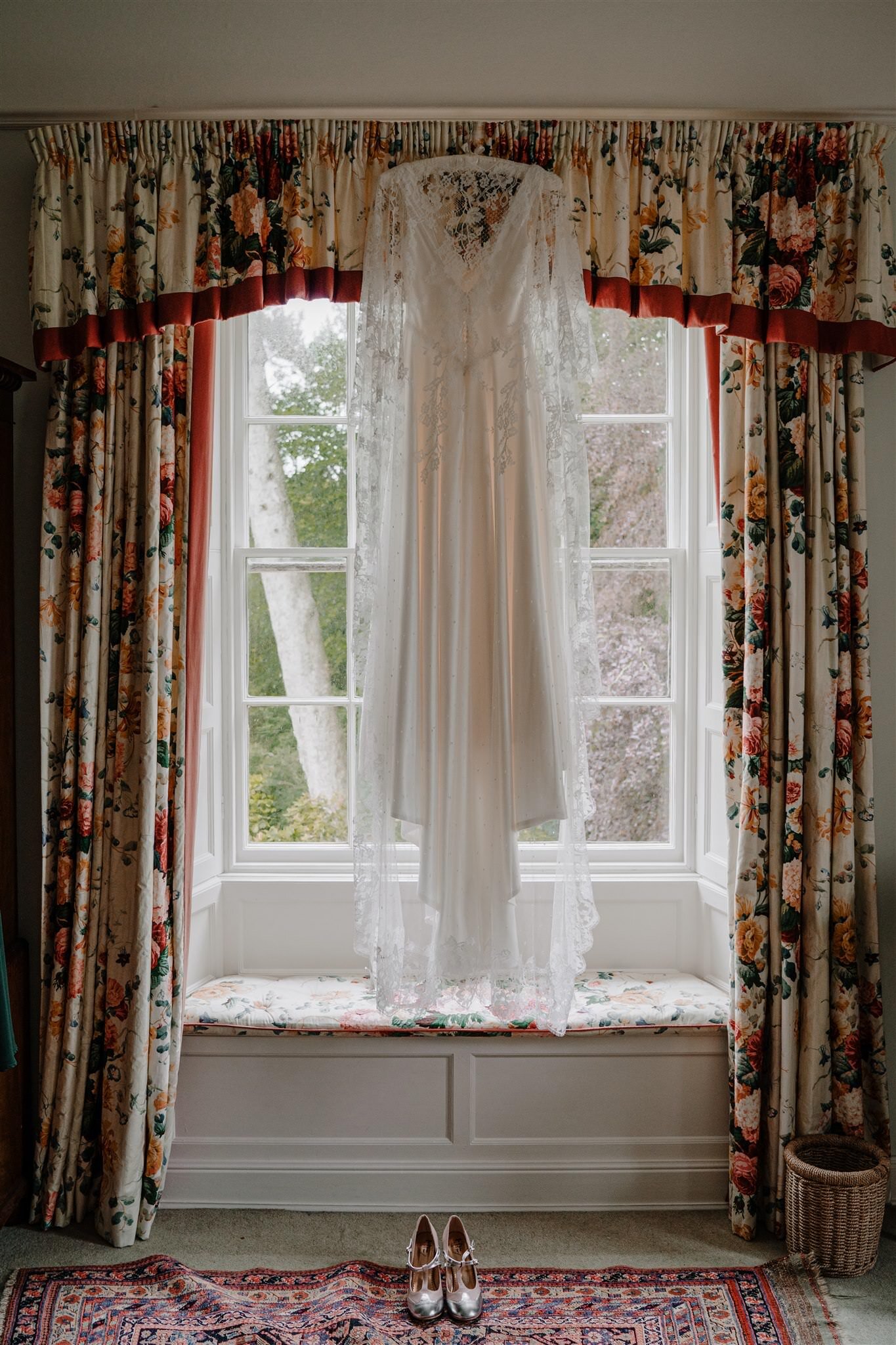 Custom Alison Jayne couture wedding dress hanging Tullyveery house window