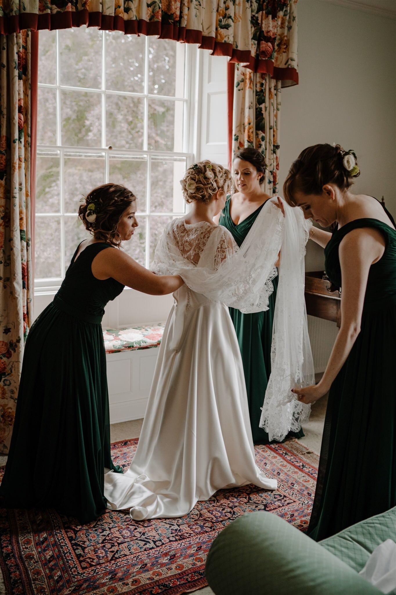 Bridesmaids help bride weddimg dress custom lace Alison Jayne couture