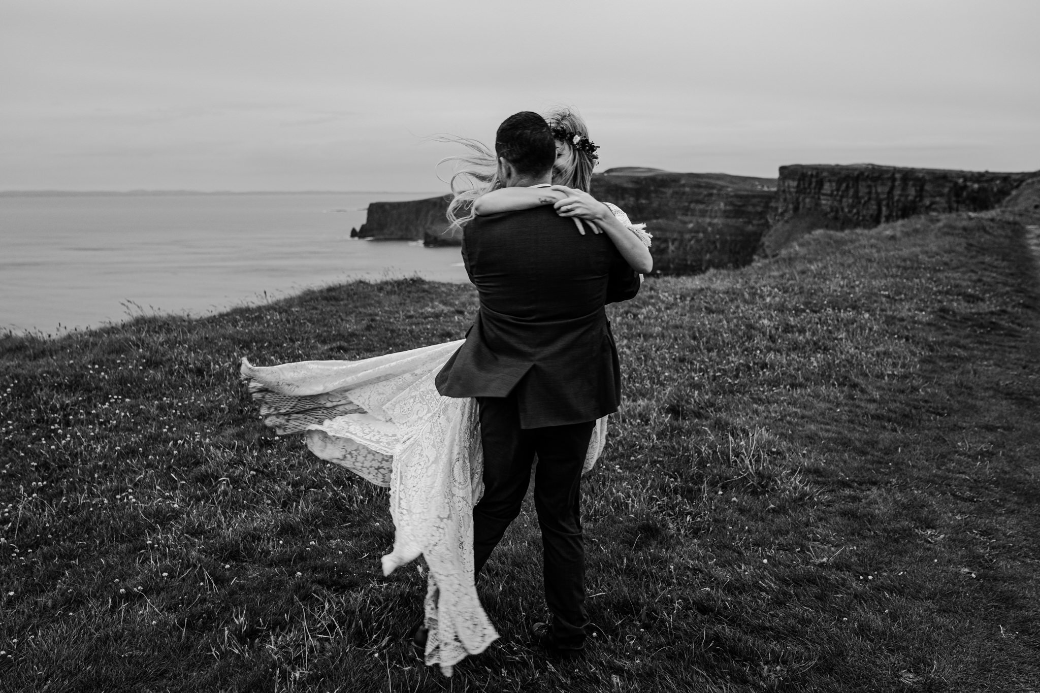husband spins wife on cliffs edge Cliffs of Moher ireland