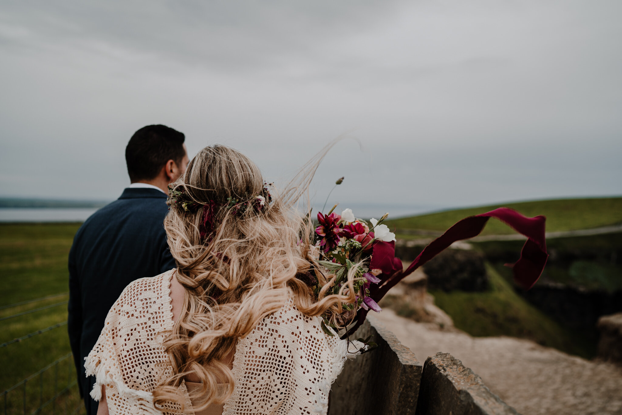 anthesis floral bouquet flows in wind at cliffs of moher adventure elopement