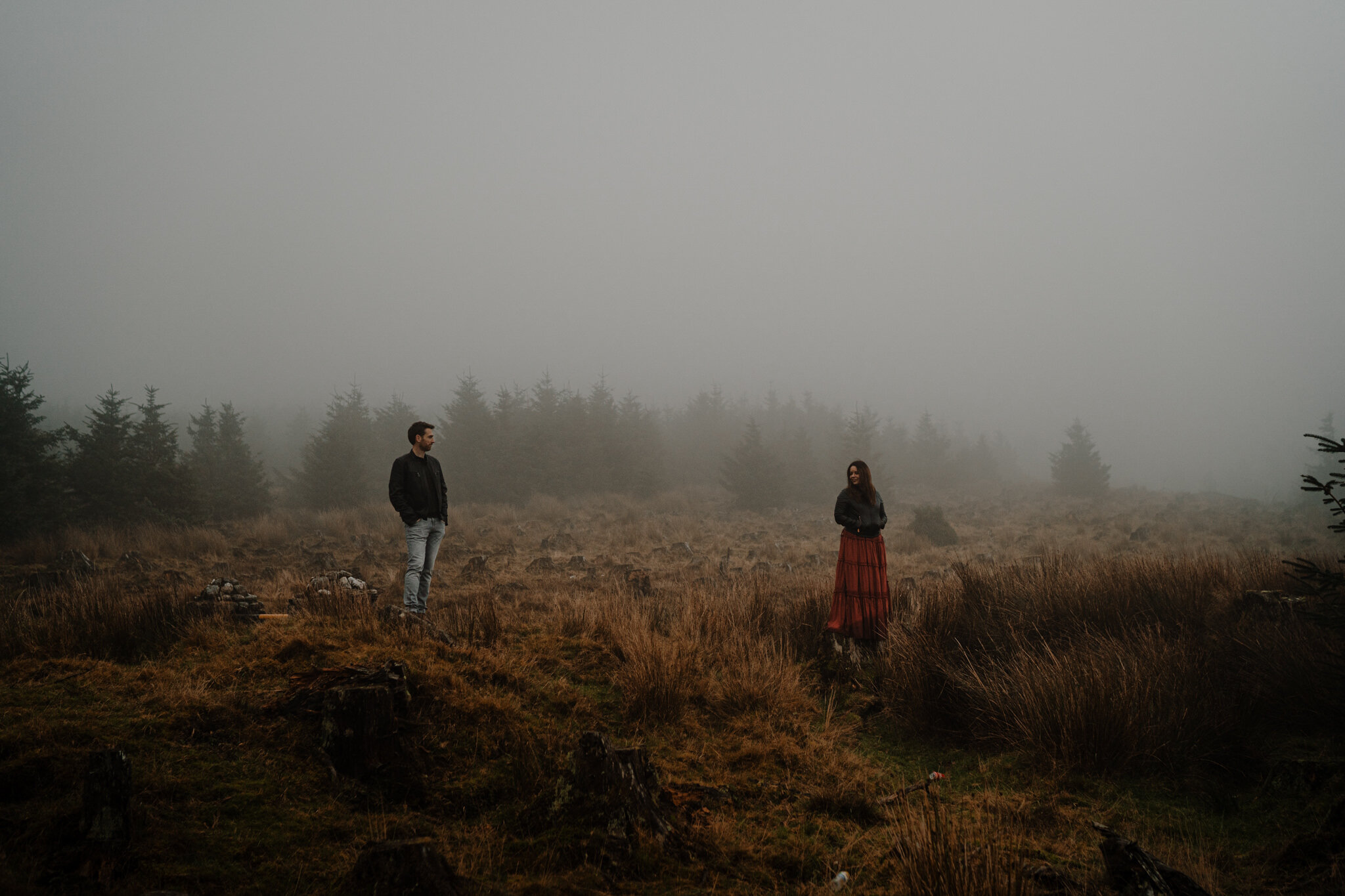 alternative engagement photos couple stand in fog on the Wicklow Mountains