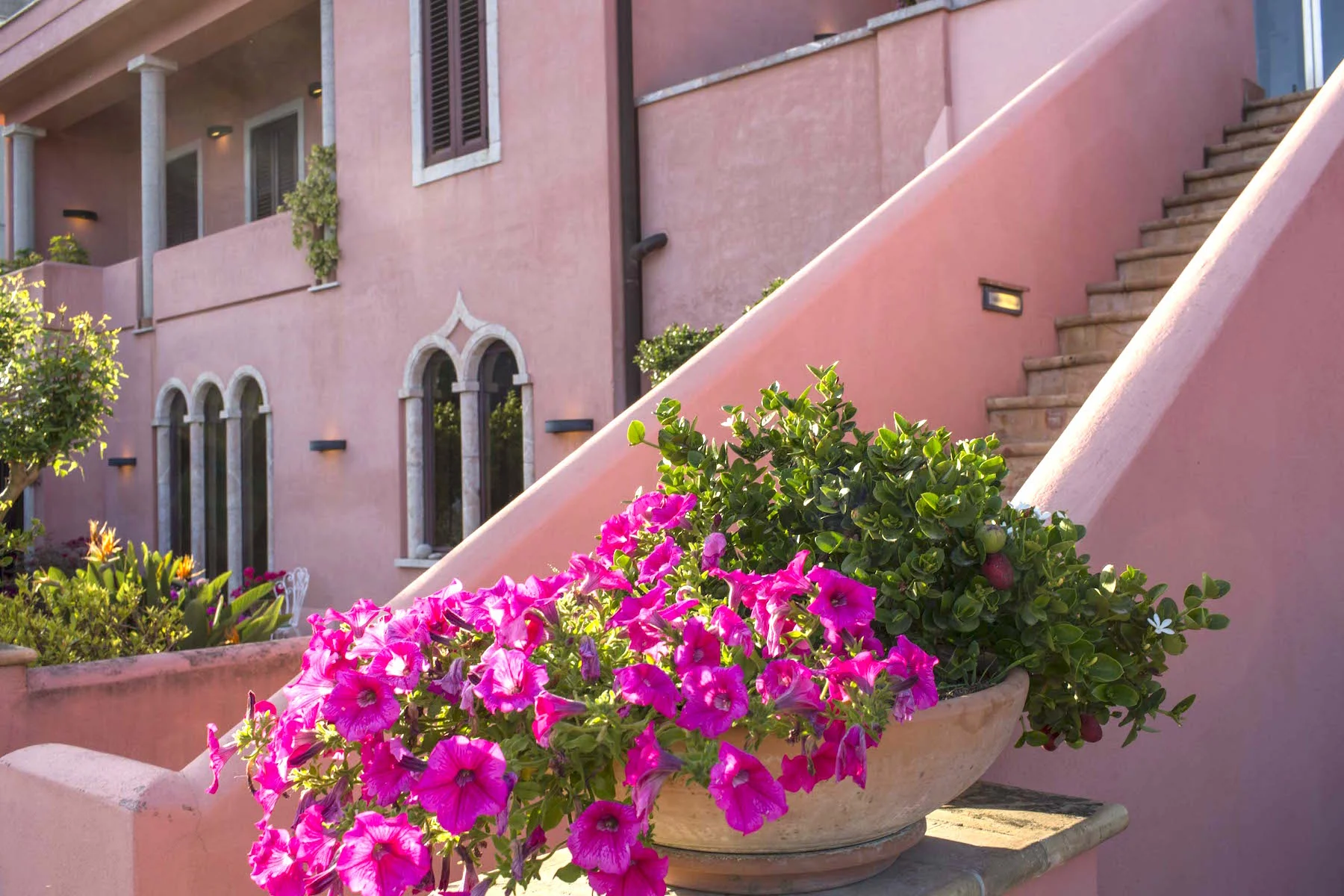 The facade of the original 1950's family house with the stairs leading to the Upper House and terrace