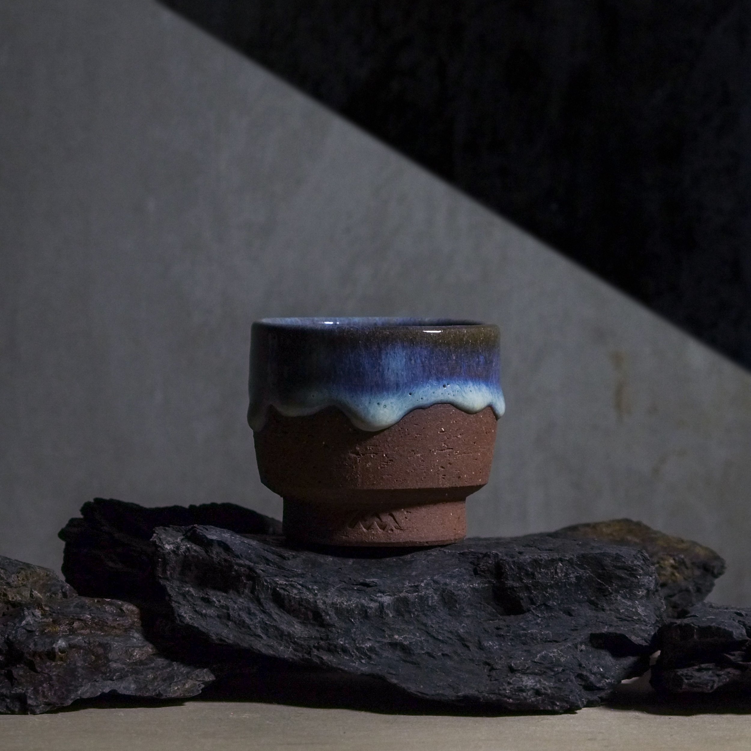 Introducing our Matsuhiro-yaki cup&mdash;a beautiful study in contrast. This piece celebrates the raw, grounding warmth of red clay, perfectly complemented by a striking, deep blue glaze that drips elegantly down the side.

The way the fluid glaze ca