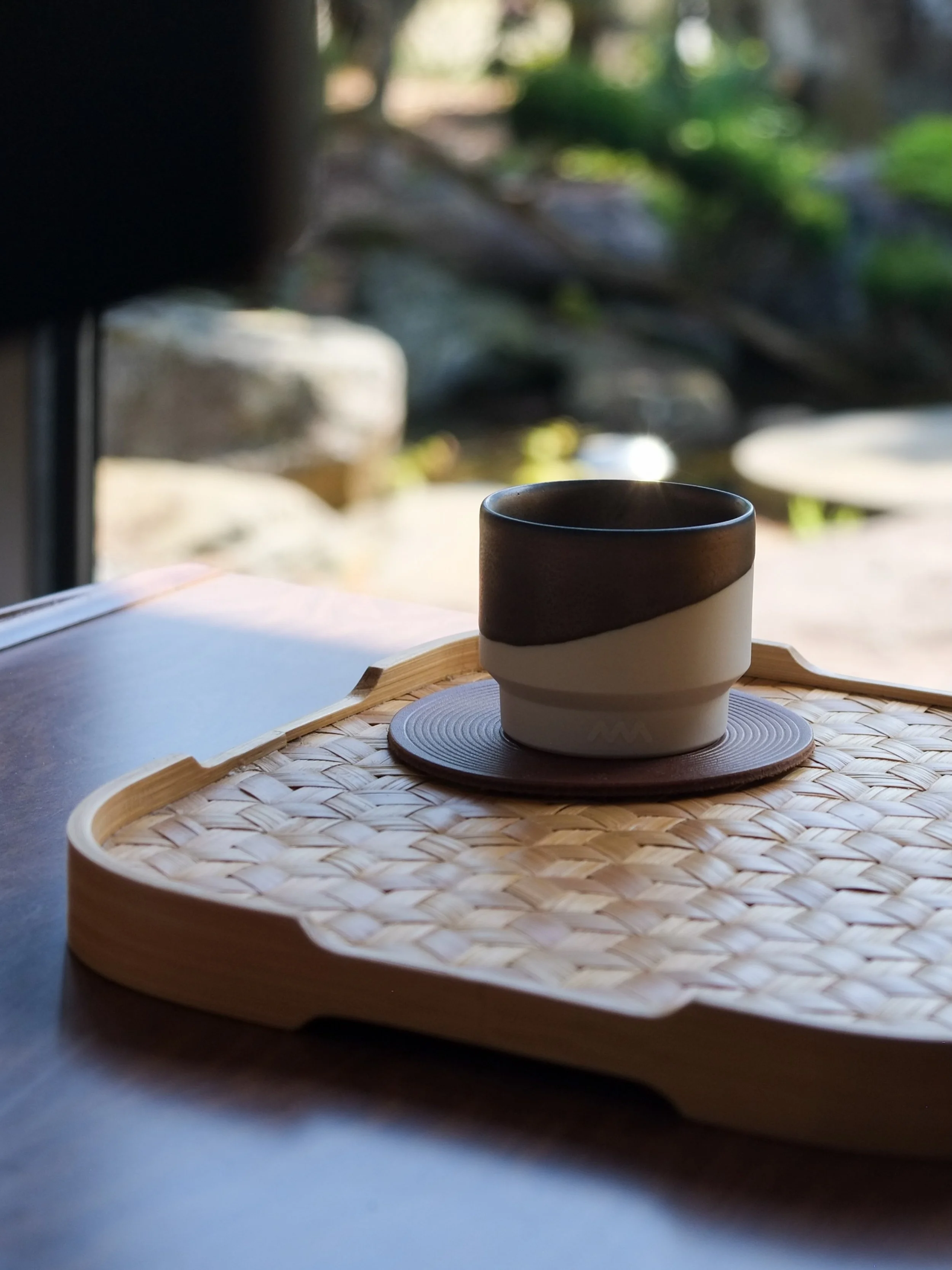 Our Hasami-yaki Bronze cup is designed to engage your senses from the very first touch. The rich, metallic bronze glaze brings a refined sophistication, while the unglazed lower half reveals the raw, soft porcelain finish&mdash;an invitation to feel 