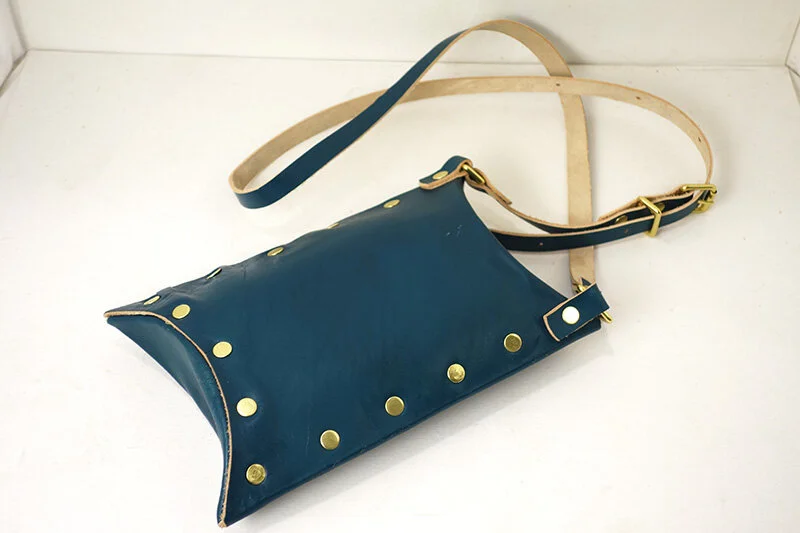 T&CMouse-teal-holster-laying-down-back.jpg