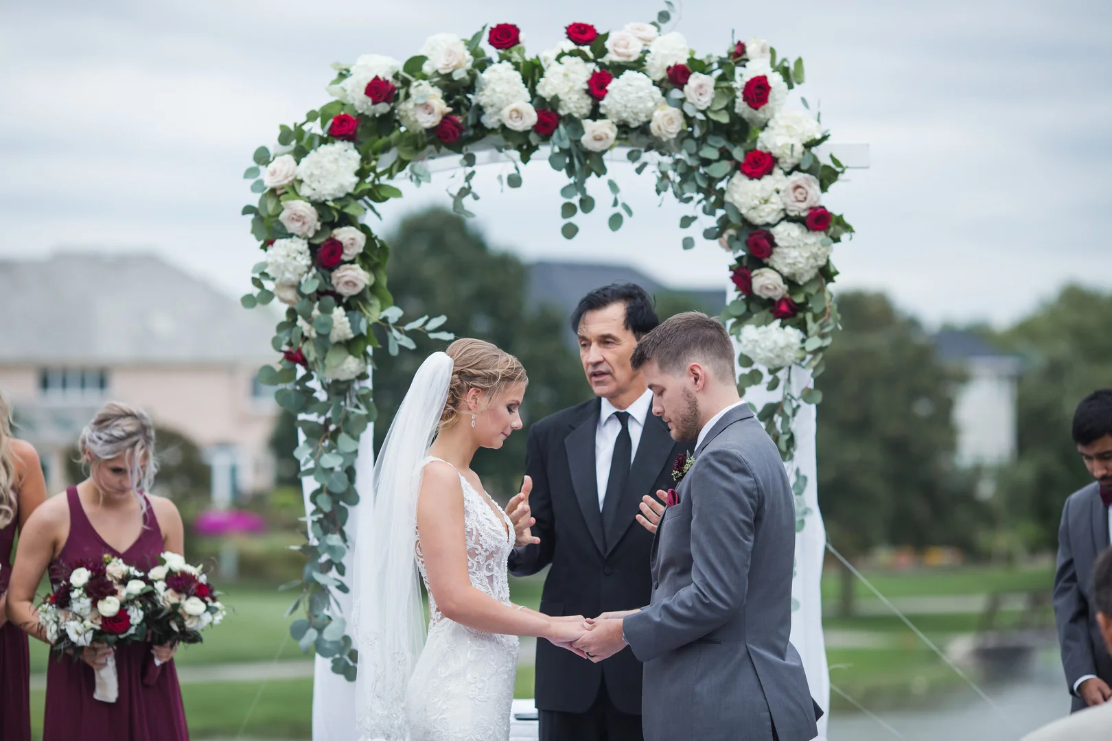Elegant ballroom wedding with deep reds and silver accents at the White Eagle Golf Club in Naperville, IL captured by Elite Photo. Find more unique wedding ideas at CHItheeWED.com!