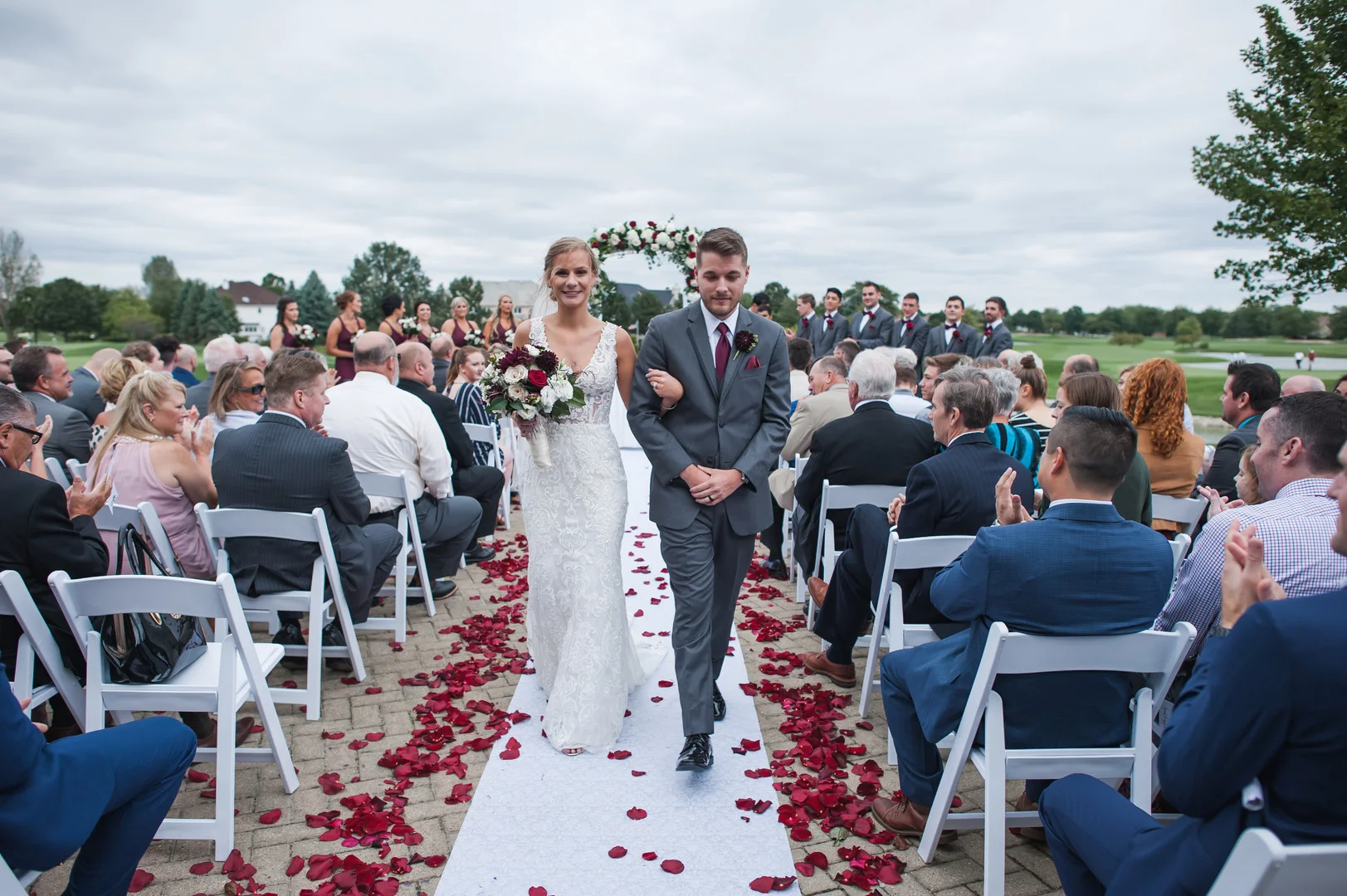Elegant ballroom wedding with deep reds and silver accents at the White Eagle Golf Club in Naperville, IL captured by Elite Photo. Find more unique wedding ideas at CHItheeWED.com!