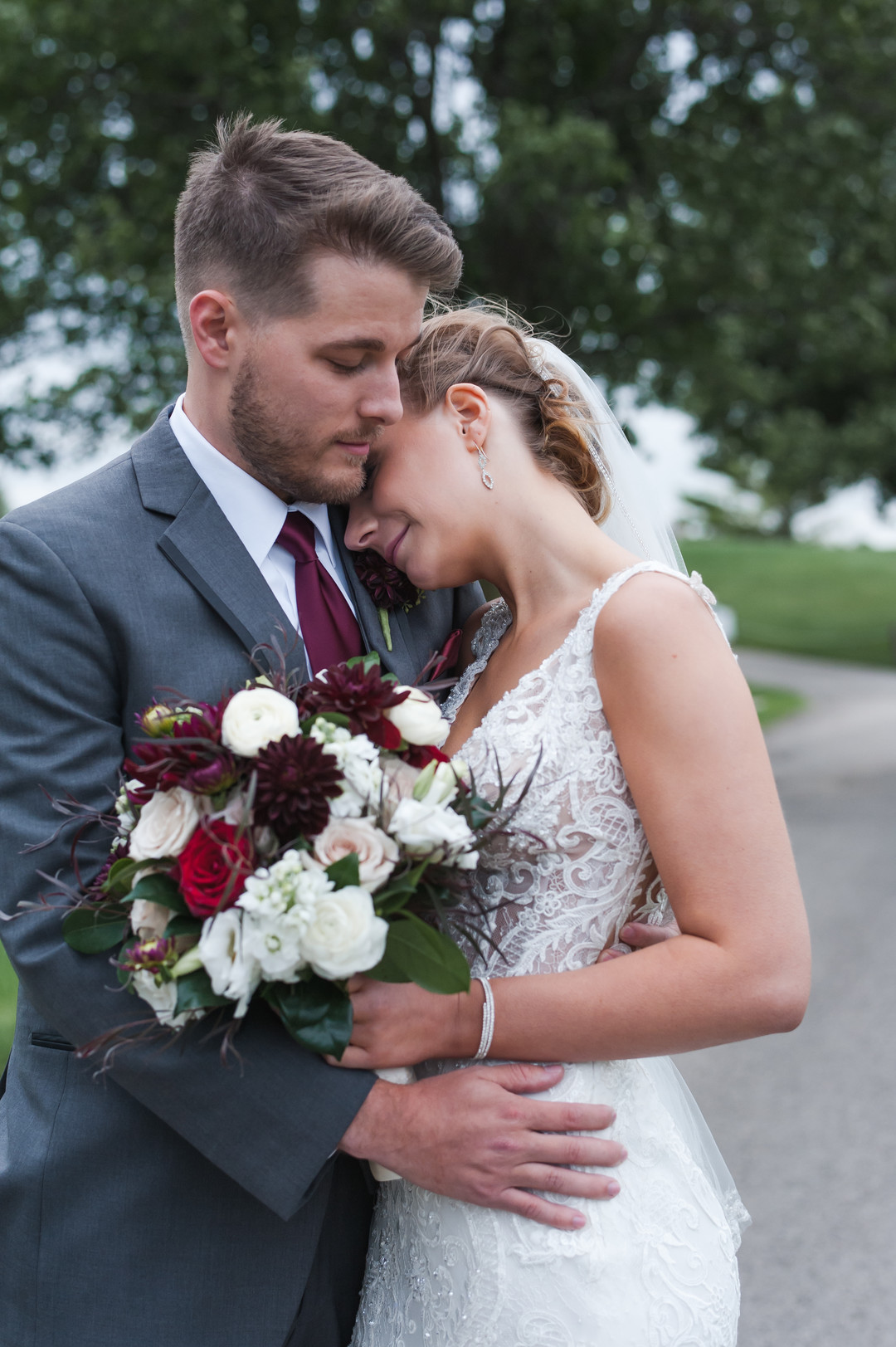 Elegant ballroom wedding with deep reds and silver accents at the White Eagle Golf Club in Naperville, IL captured by Elite Photo. Find more unique wedding ideas at CHItheeWED.com!