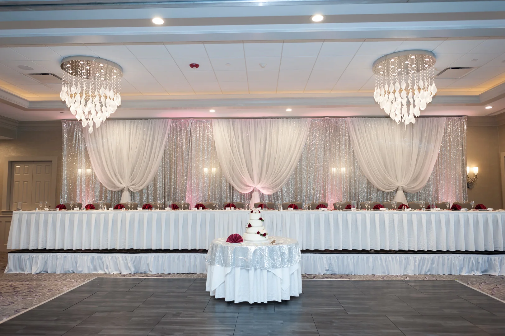 Elegant ballroom wedding with deep reds and silver accents at the White Eagle Golf Club in Naperville, IL captured by Elite Photo. Find more unique wedding ideas at CHItheeWED.com!