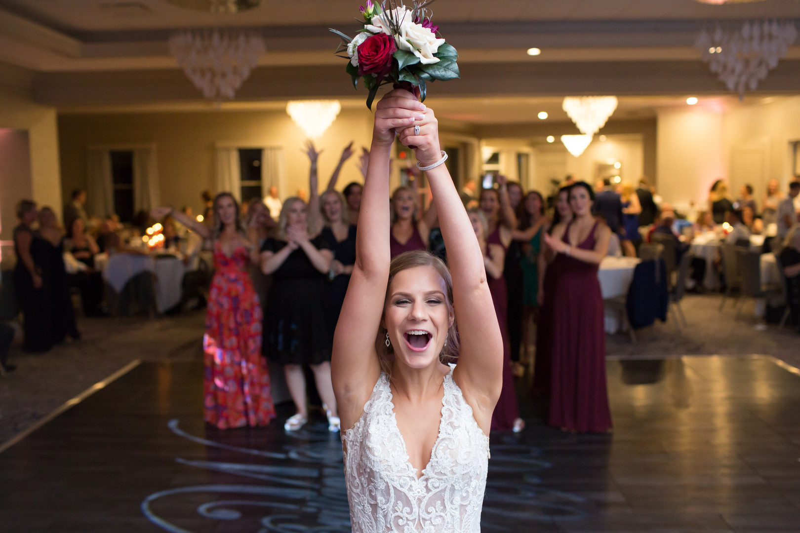 Elegant ballroom wedding with deep reds and silver accents at the White Eagle Golf Club in Naperville, IL captured by Elite Photo. Find more unique wedding ideas at CHItheeWED.com!