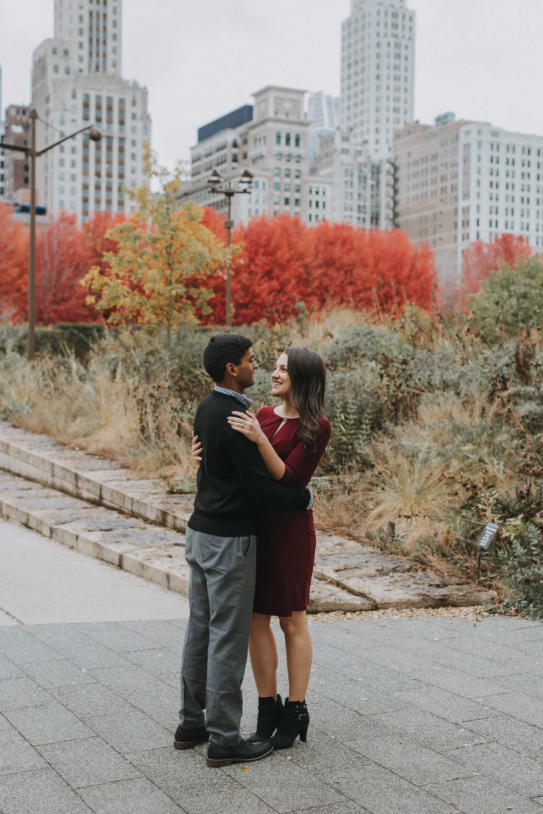 Chicago rooftop and Millennium Park engagement session captured by Kendra Lynece Photography. See more engagement photo ideas at CHItheeWED.com!