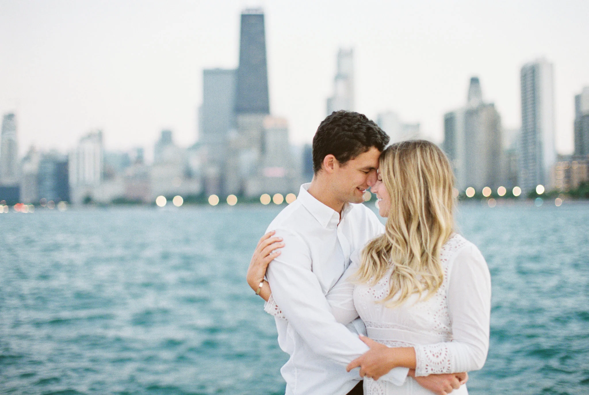 Romantic North Avenue Beach Chicago engagement session captured by Kendra Denault Photography. See more engagement photo ideas on CHItheeWED.com!