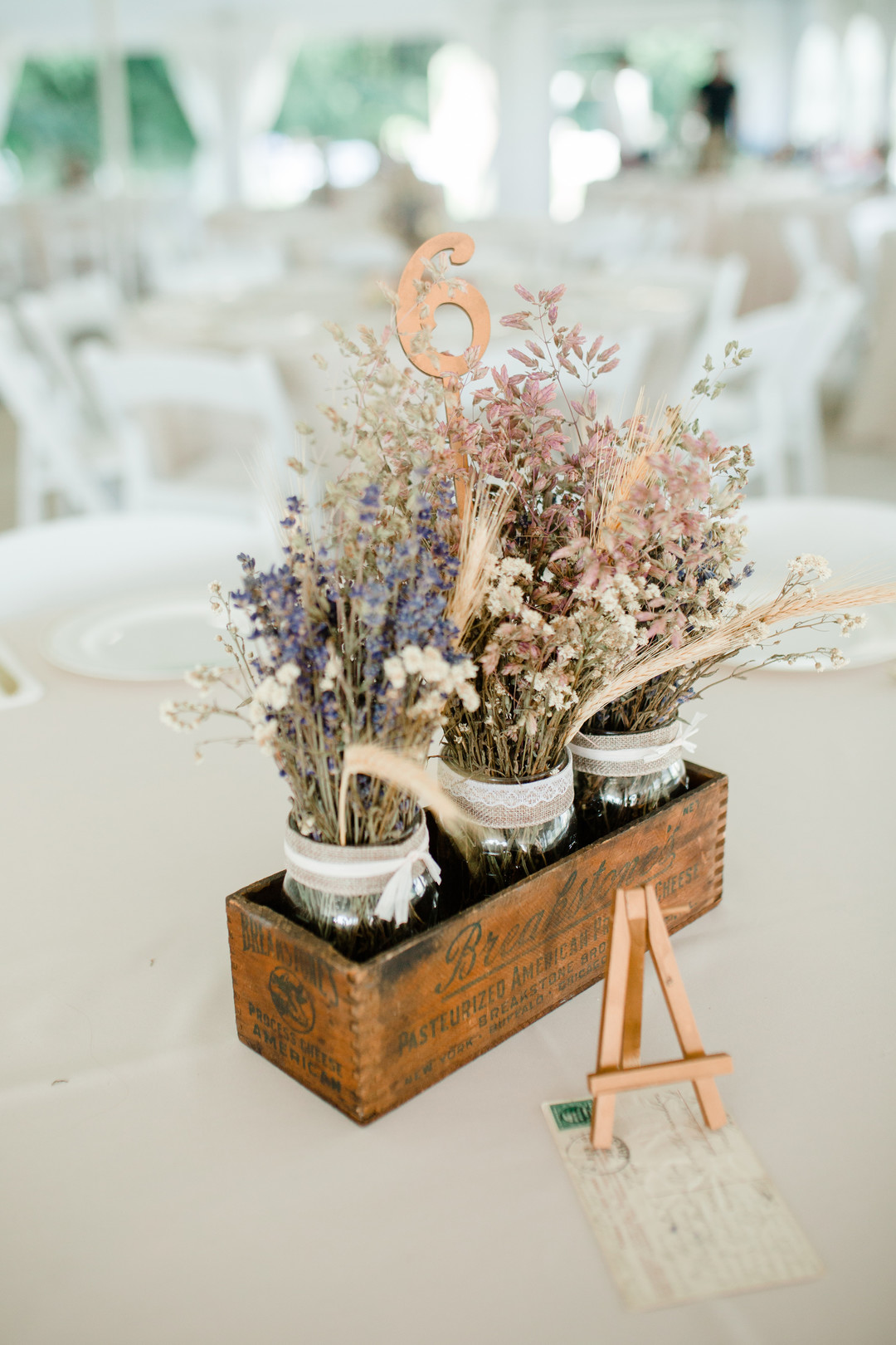 Rustic wedding centerpieces: Rustic country wedding in Minooka, IL captured by Katie Brsan Photography. Visit CHItheeWED.com for more wedding inspiration!
