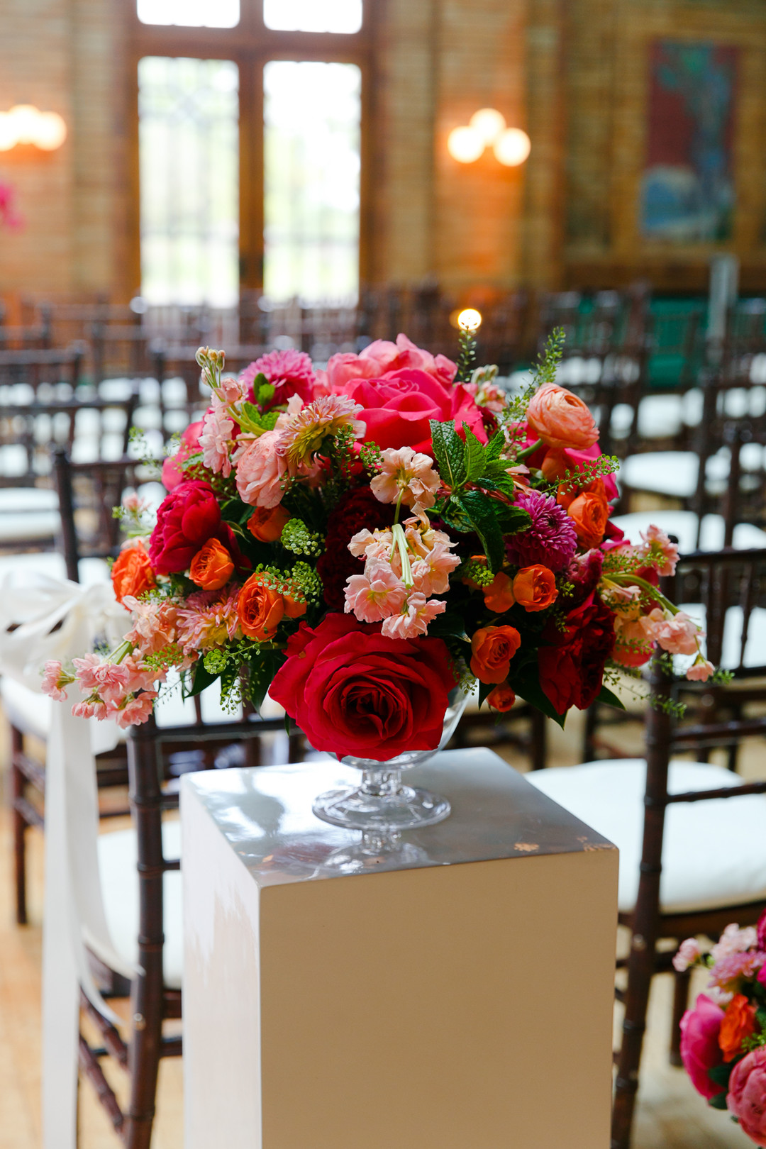 Pink and red wedding flowers: Timeless and colorful Chicago wedding in Lincoln Park captured by StudioThisIs. See more wedding ideas at CHItheeWED.com!