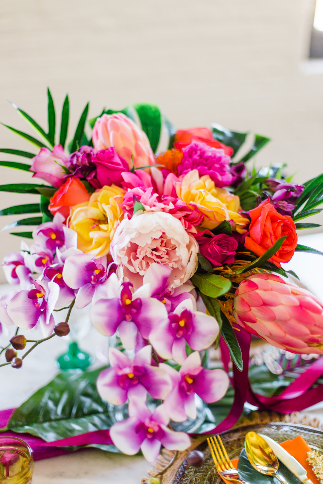 Bright and tropical wedding centerpieces: Tropical Eclectic Wedding Inspiration captured by Grace Rios Photography featured on CHI thee WED. See more colorful wedding ideas at CHItheeWED.com!