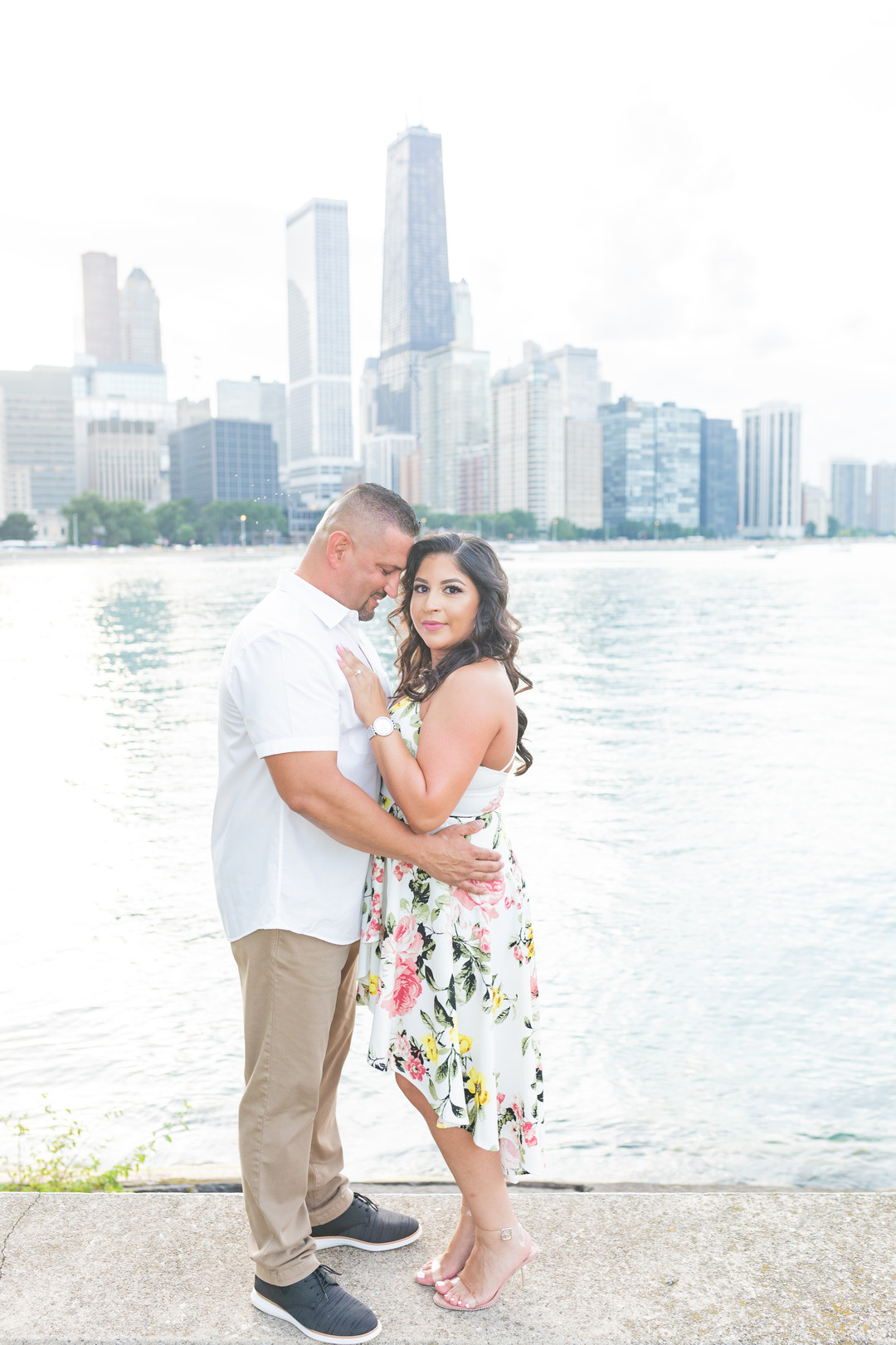 Chicago skyline engagement session captured by Emma Belen Photography. See more engagement photo ideas featured on CHItheeWED.com!