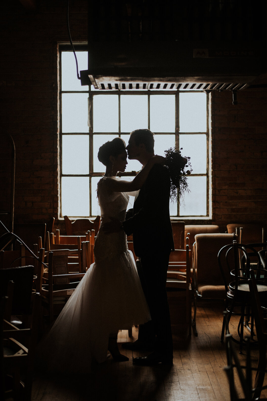 Gothic Romance in Three Story Vintage Warehouse captured by Allie Appeal and styled by Ariana Anderson featured on CHI thee WED. See more moody wedding ideas at CHItheeWED.com!