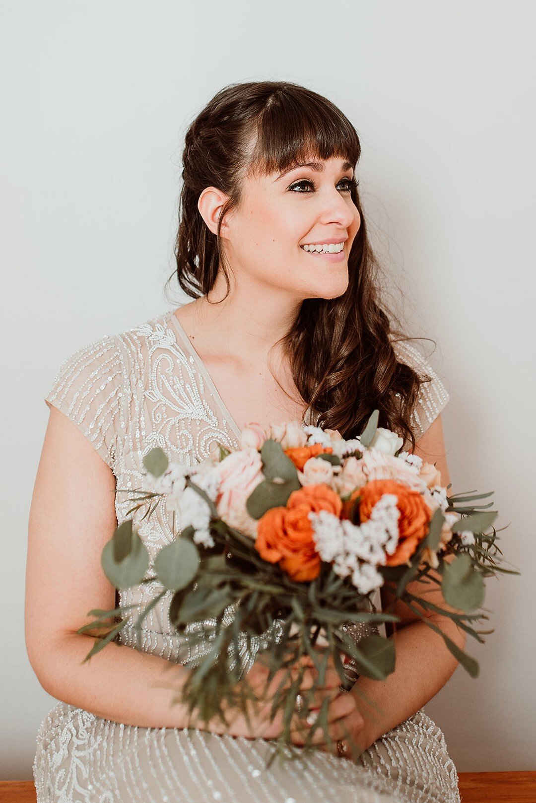 Orange and white wedding bouquet: Low-Key &amp; High Style Chicago Wedding captured by Emily-Melissa Photography. Find more creative wedding ideas at CHItheeWED.com!