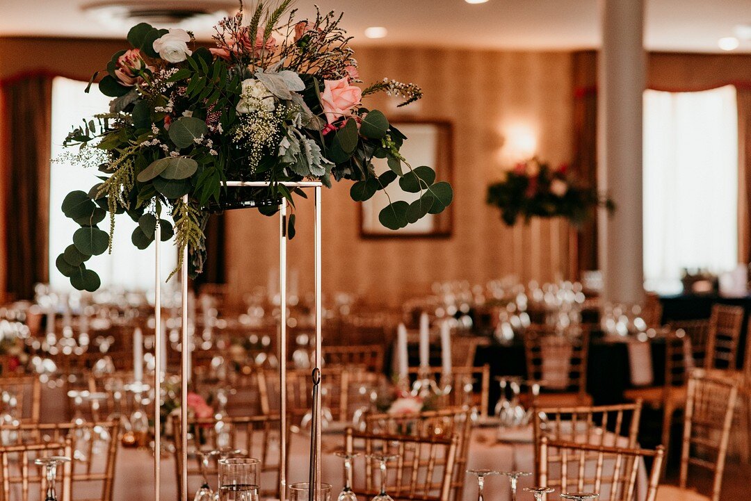 Tall wedding centerpieces: Sophisticated Southside Chicago wedding captured by Emily-Melissa Photography LLC featured on CHI thee WED. Find more Chicago wedding ideas on CHItheeWED.com!