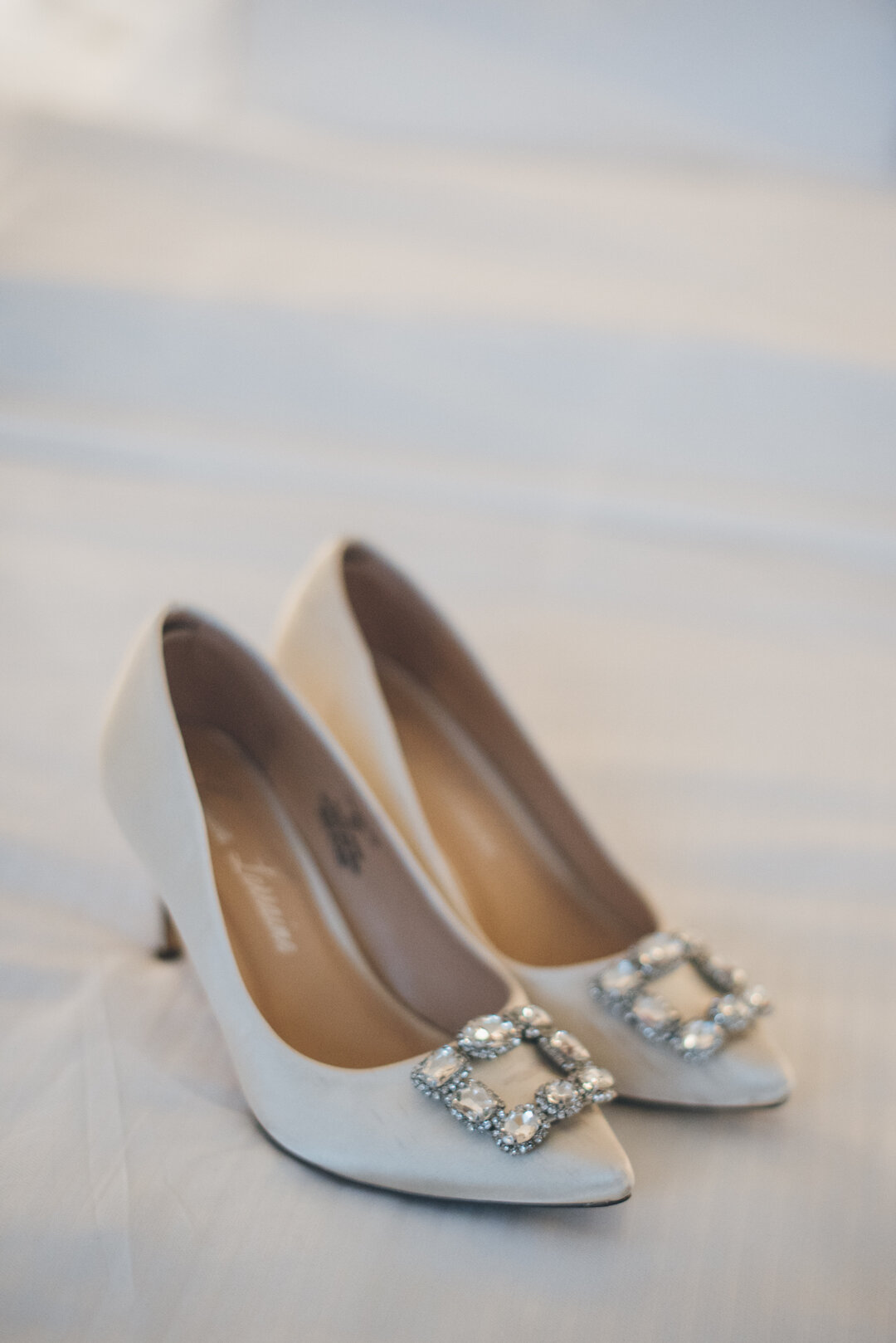 Embellished wedding shoes: Classic Chicago Winter Wedding captured by Zach Caddy featured on CHI thee WED. See more winter wedding ideas at CHItheeWED.com!