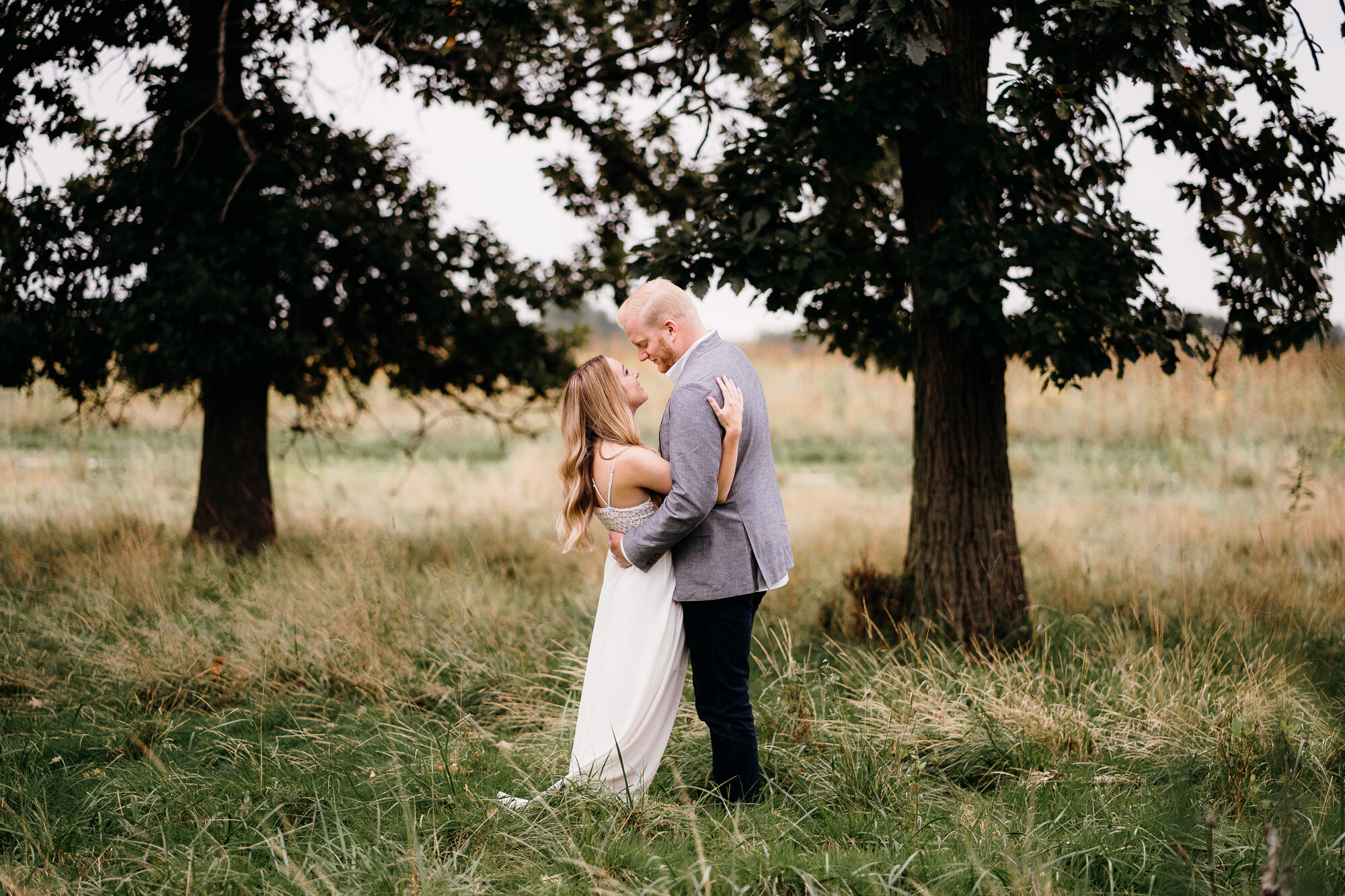 Romantic Late Summer Meadow Engagement Session captured by Kevin Kienitz Photography featured on CHI thee WED