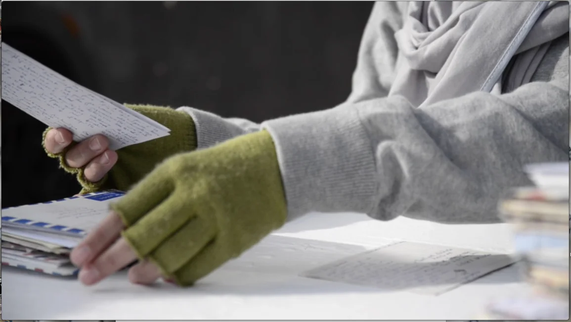 Lettres pour Yaya Mujinga; as read by her grandchild. 2015. Film still. Image Credit: Karl Schwiesow