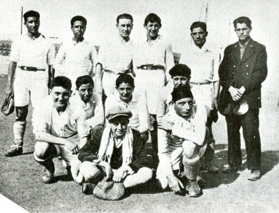 Camus is in the front row, in the scarf and hat.