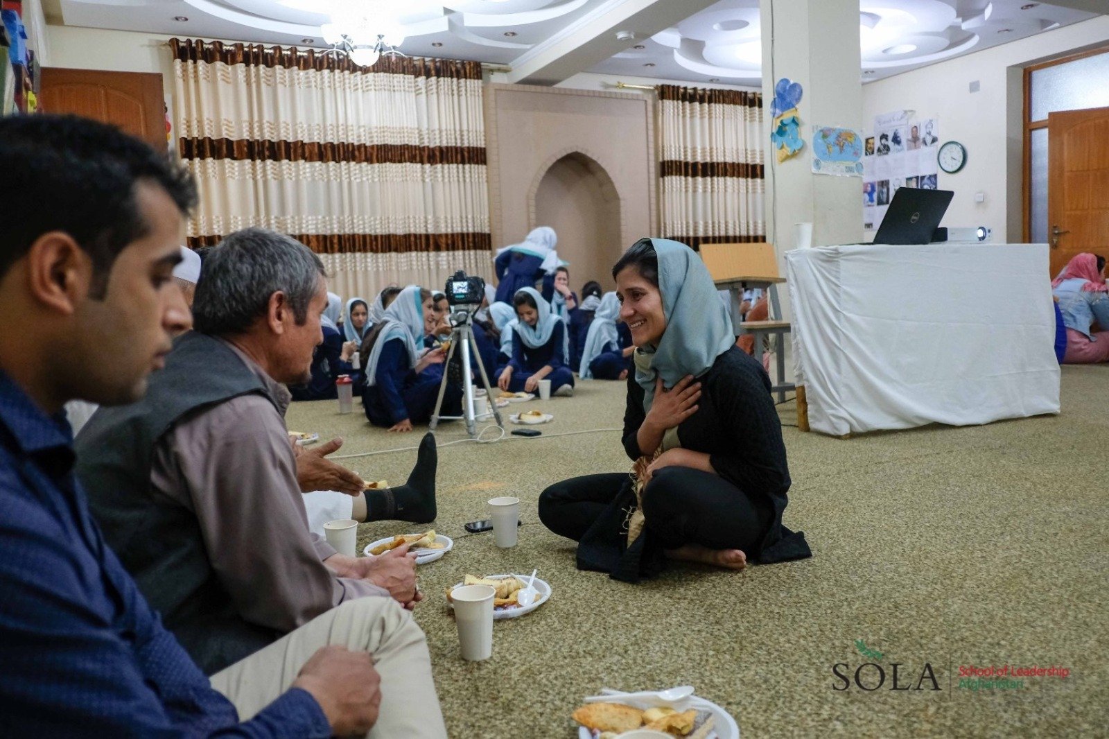  Shabana meeting with students’ families at an all-school assembly.  