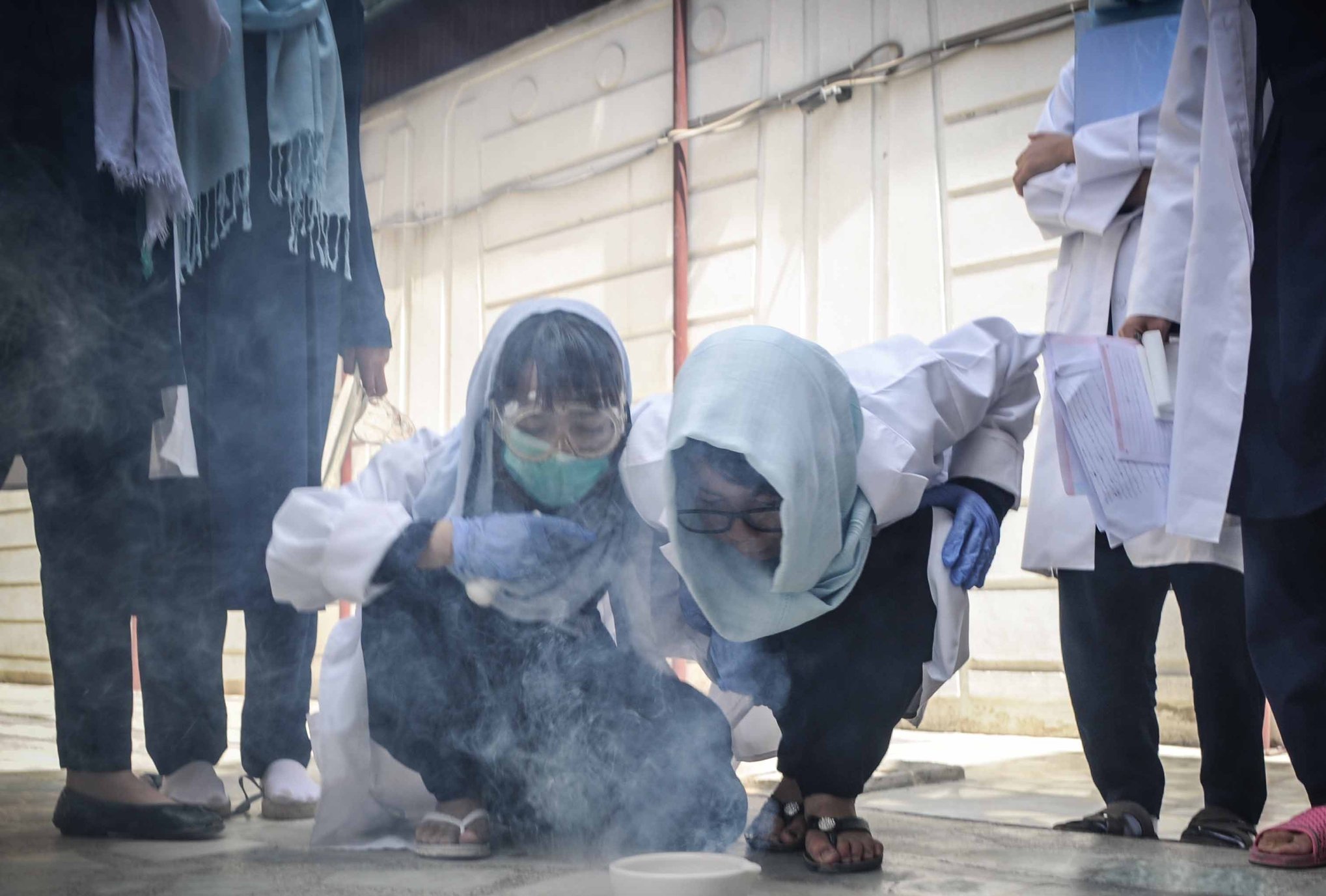  SOLA students taking part in an experiment for science class. 