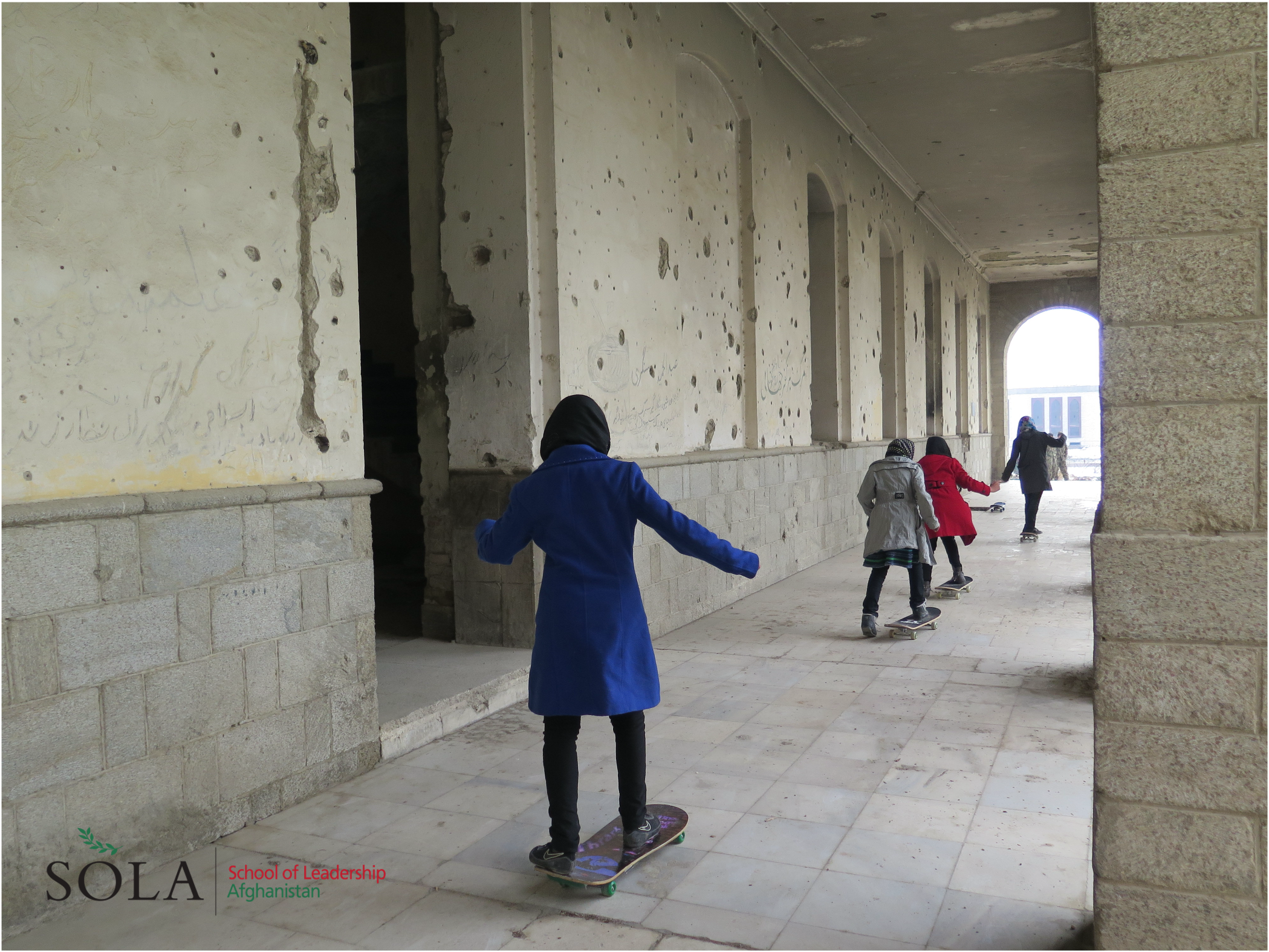  SOLA students skateboarding through the streets of Kabul. 