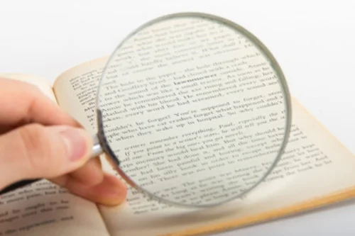 MagnifierLookingAtBook.jpg