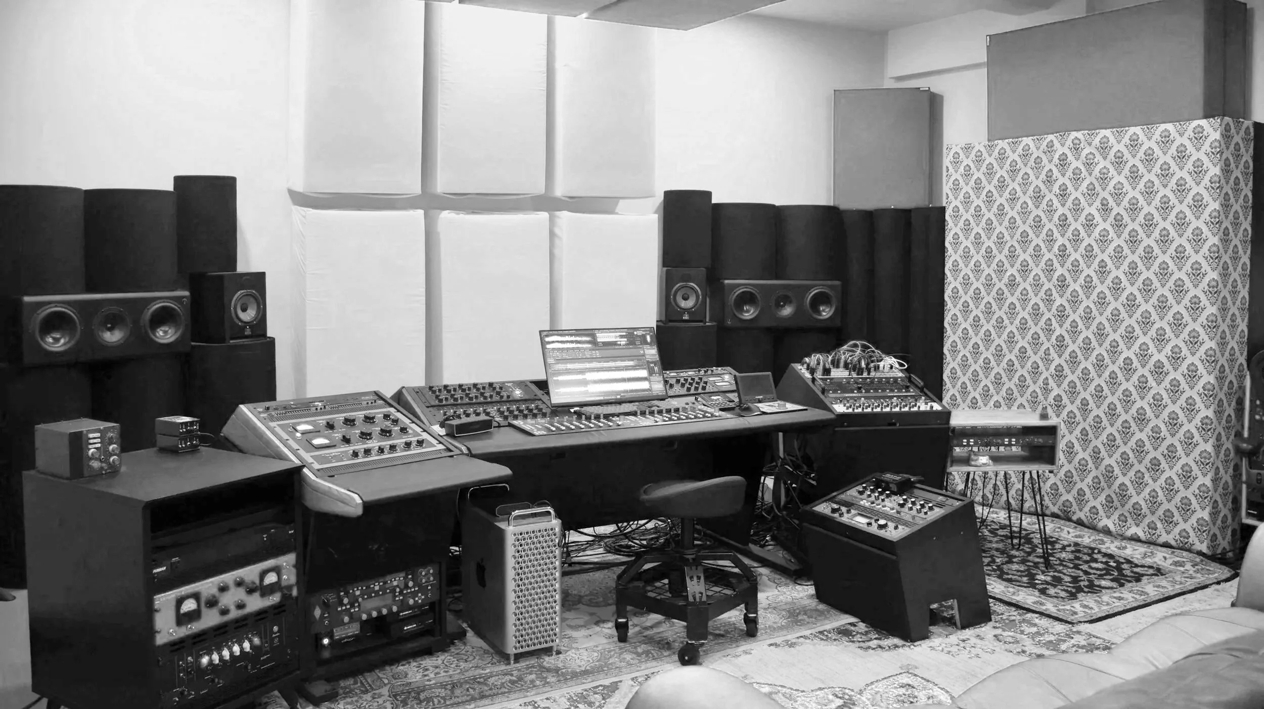 Wide view of the Rose Quartz Mastering room in San Diego, with the mastering desk, outboard racks and monitors