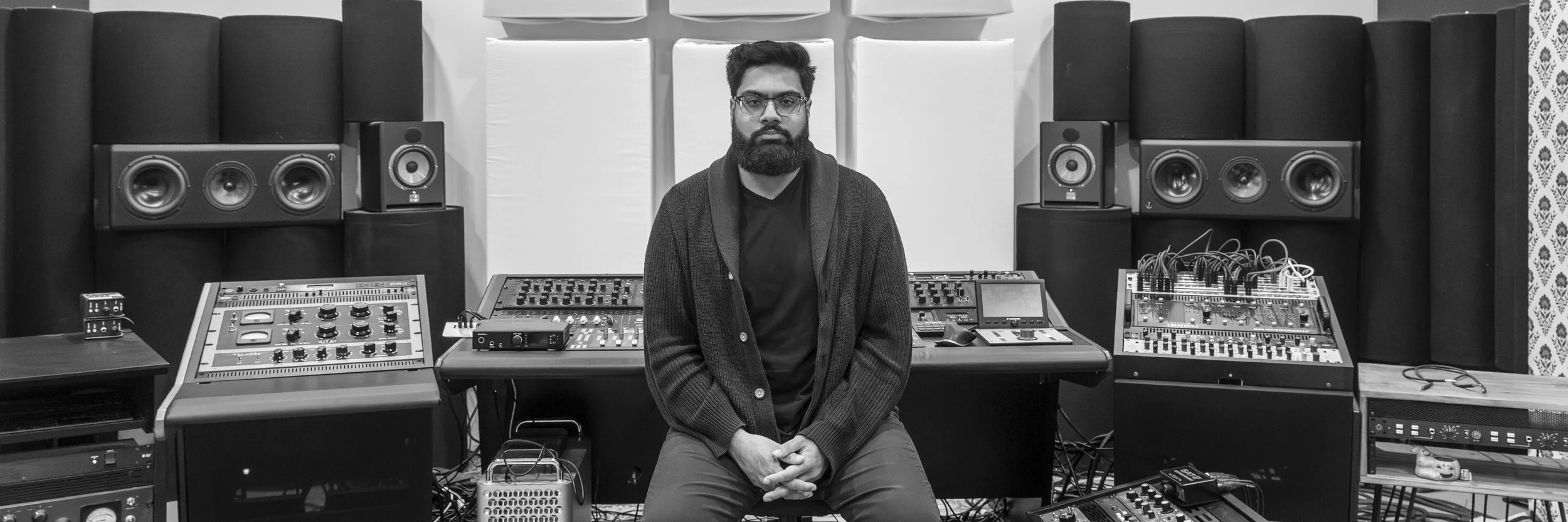 Sam Kumar Tandon at the mastering desk at Rose Quartz Mastering in San Diego