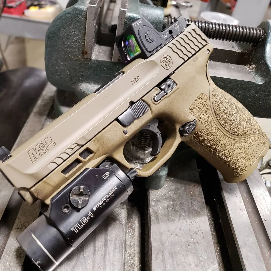 RMR slide cut with Glock dovetail for backup irons. Cerakote in FDE.