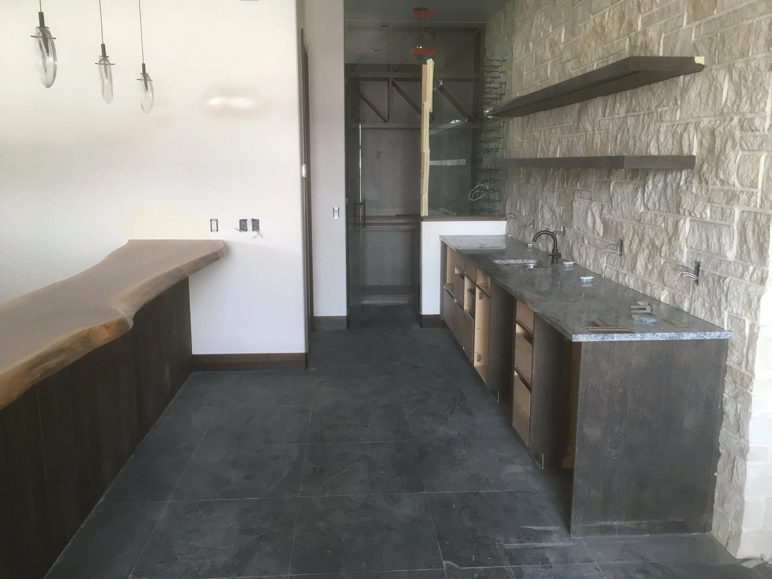 The view of the bar top opposite the wet-bar and wine room.