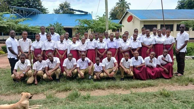 Here is a photo of the scholarship students as well as their headmaster, Pastor Frank Mauyo, and the vice principle. This is 27 girls and 11 boys.   ﻿You have changed the life of these students.  Asante Sana!