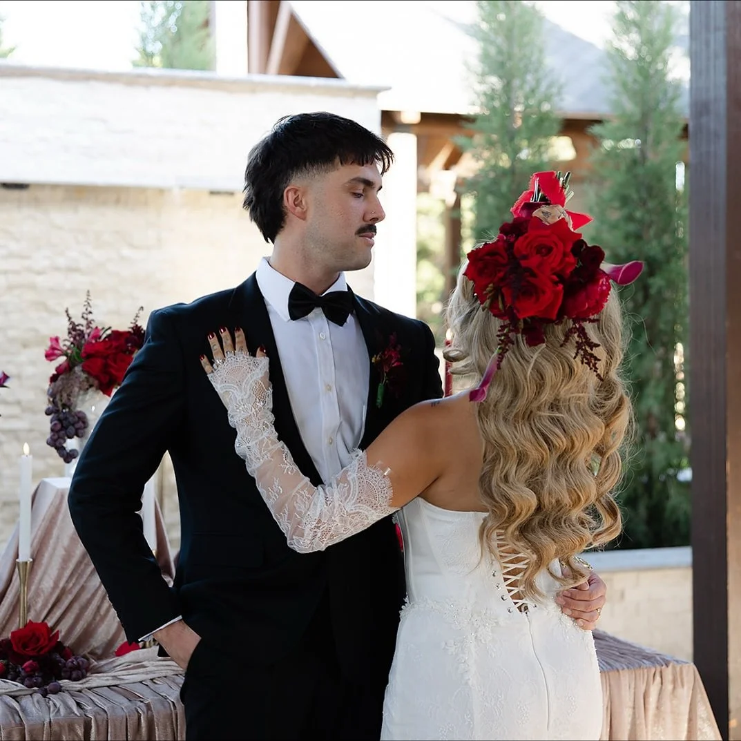 Set against the romantic backdrop of Rose Briar Place, this styled shoot captures the balance between timeless elegance and modern drama. Flowing ivory drapery, golden candlelight, and sculptural florals set the stage for a love story that feels both