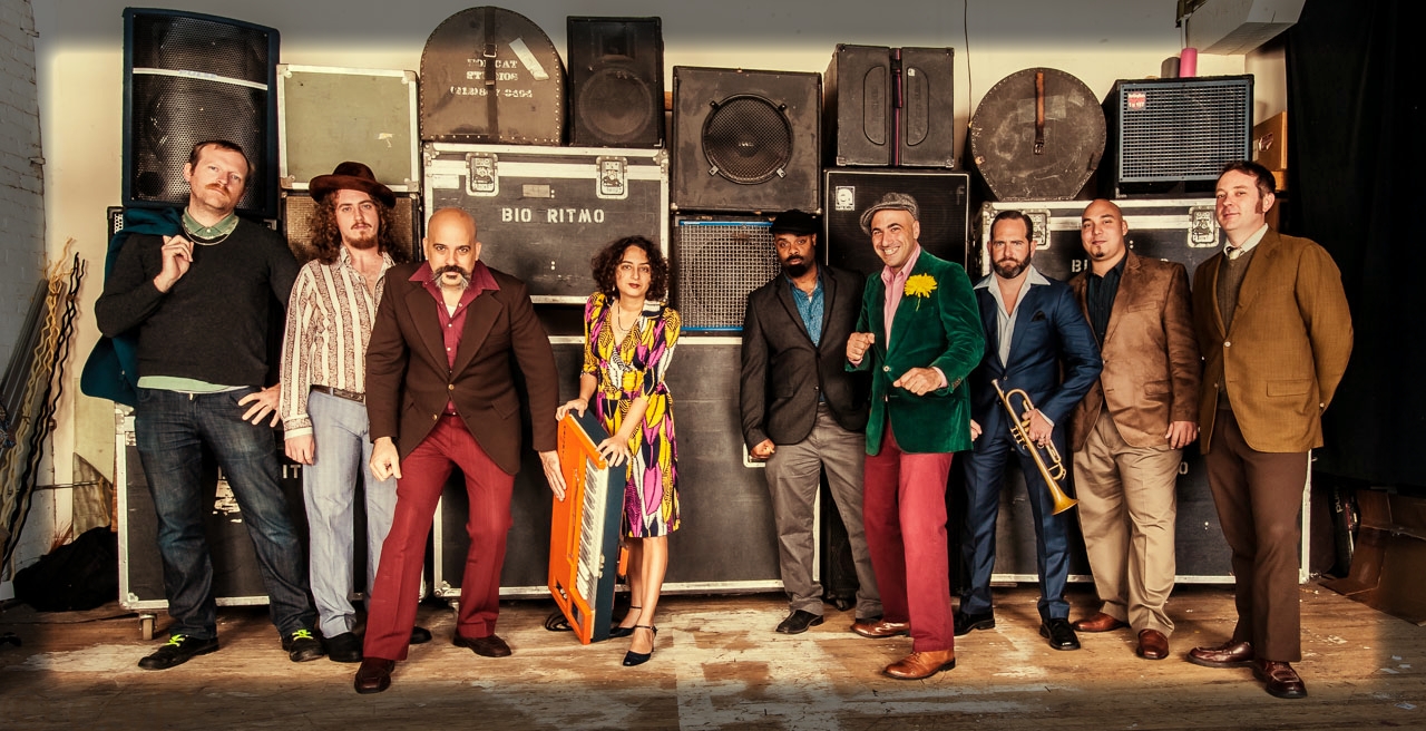 Left to Right: Edward Prendergast, Bass / John Lilley, Tenor Sax, / Rei Alvarez, Lead Vocals, Composer / Marlysse Simmons, Keyboards, Composer / Hector "Coco" Barez, Congas / Giustino Riccio, Timbale, Coros, Composer / Bob Miller, Trumpet, Synth, Coros / Marc Roman, Bongo / Tobias Whitaker, Trombone, Composer. Not pictured Will Roman, Trumpet. Photo by Chris Smith