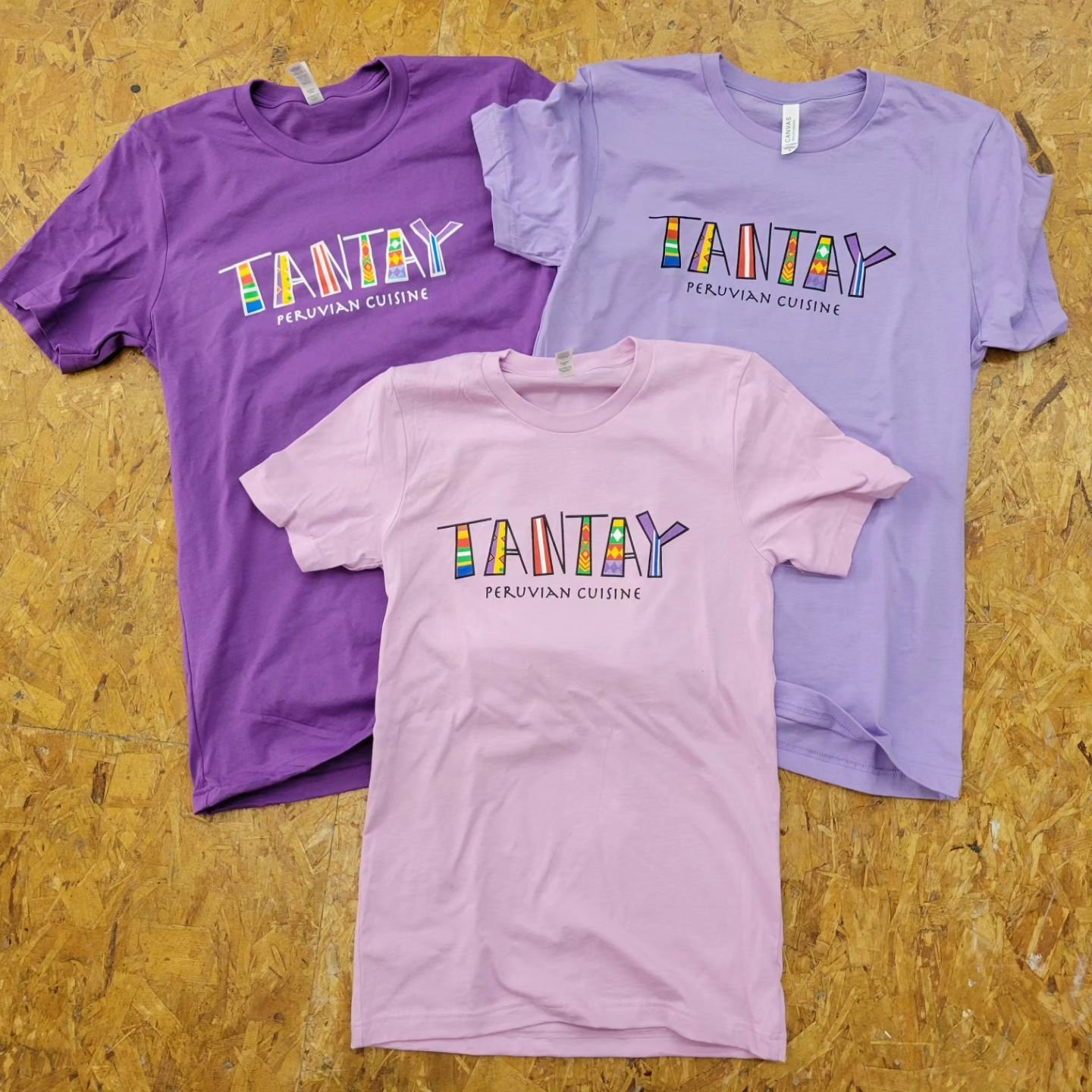 @tantay.lansing is having their grand opening tomorrow! Located in okemos, check them out and get some great Peruvian cuisine!
&bull;
8 color shirts on @bellacanvas with a qr code on the back for their menu. Fun design with vibrant colors!
