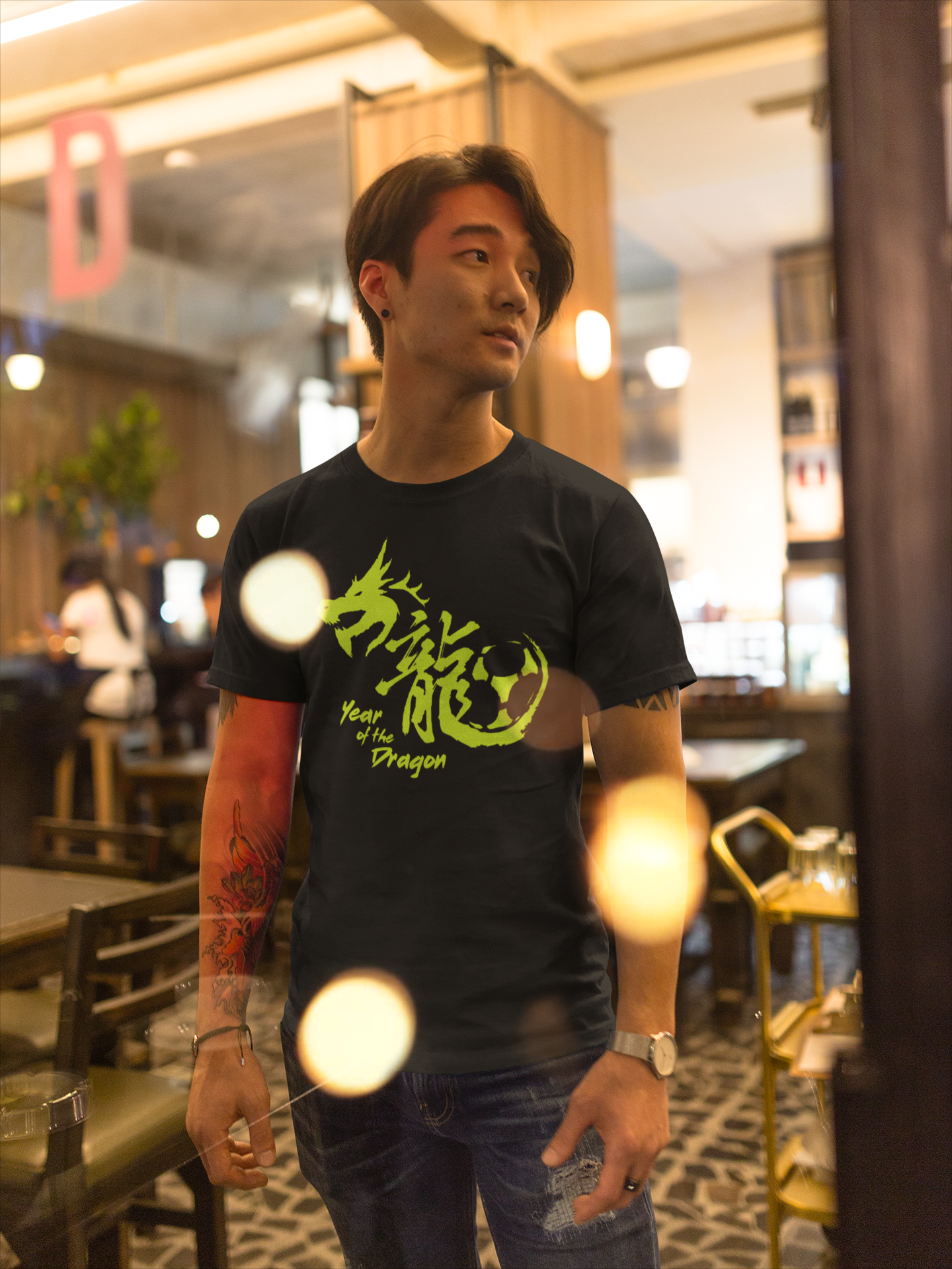 asian-fashion-man-wearing-a-t-shirt-mockup-while-at-a-restaurant-a17807.png