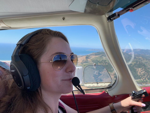 Caitlin flying by Morro Bay