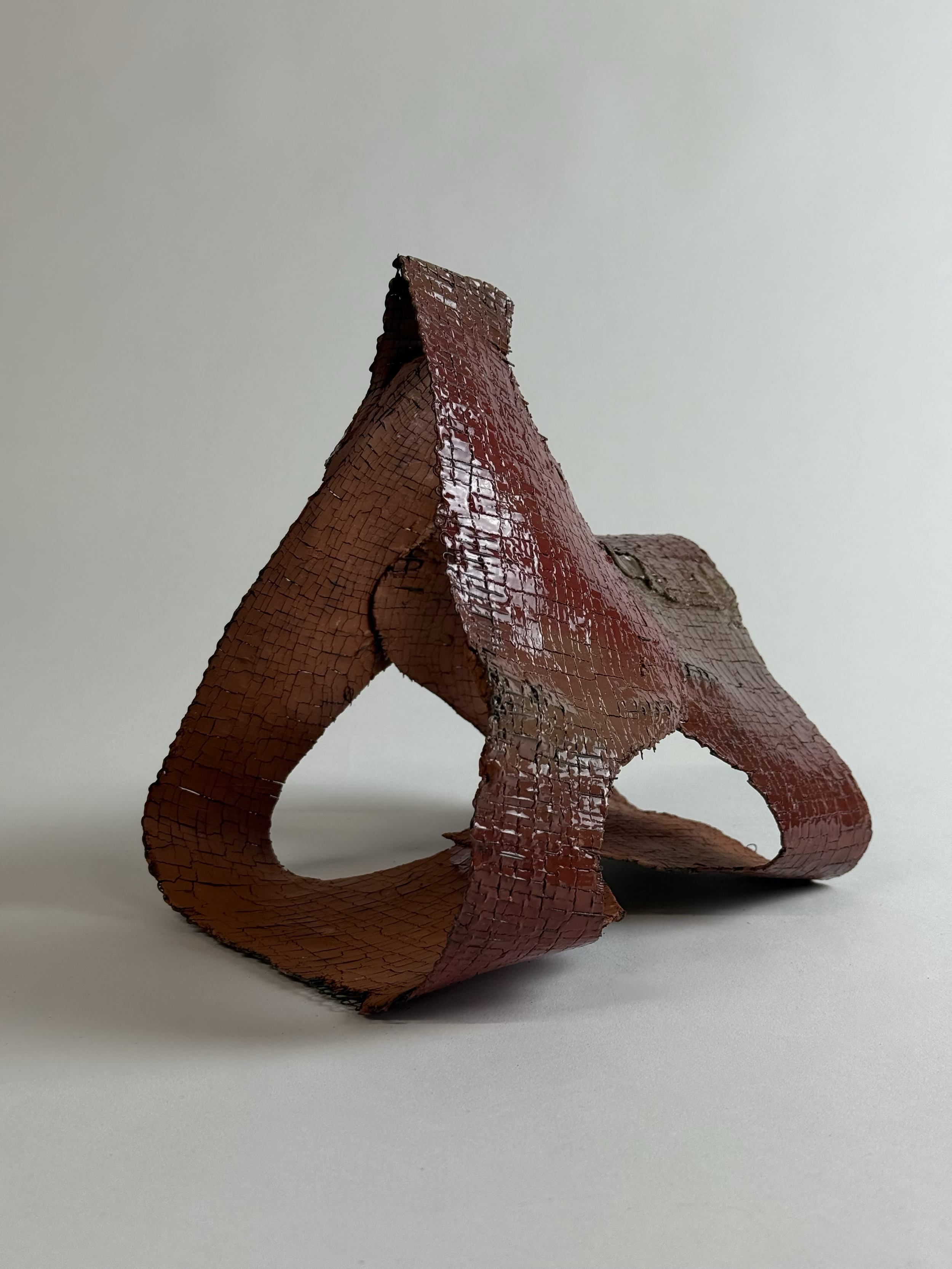 untitled;
2026;
ceramic, handwoven wire, glaze