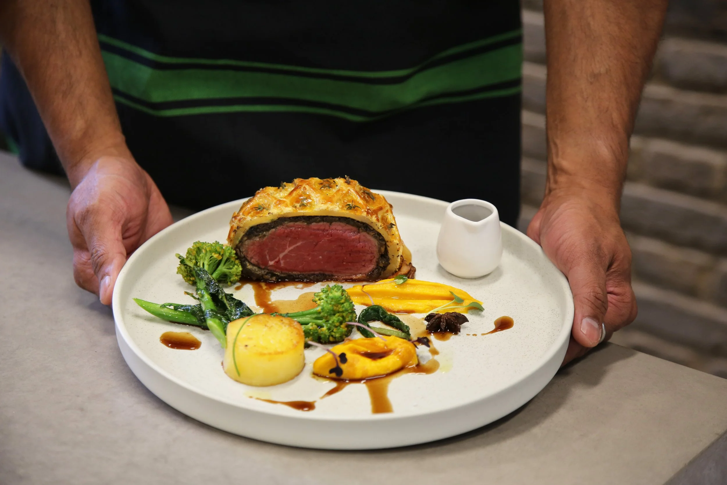 Beef Wellington with porcini jus, duxelle potato fondant