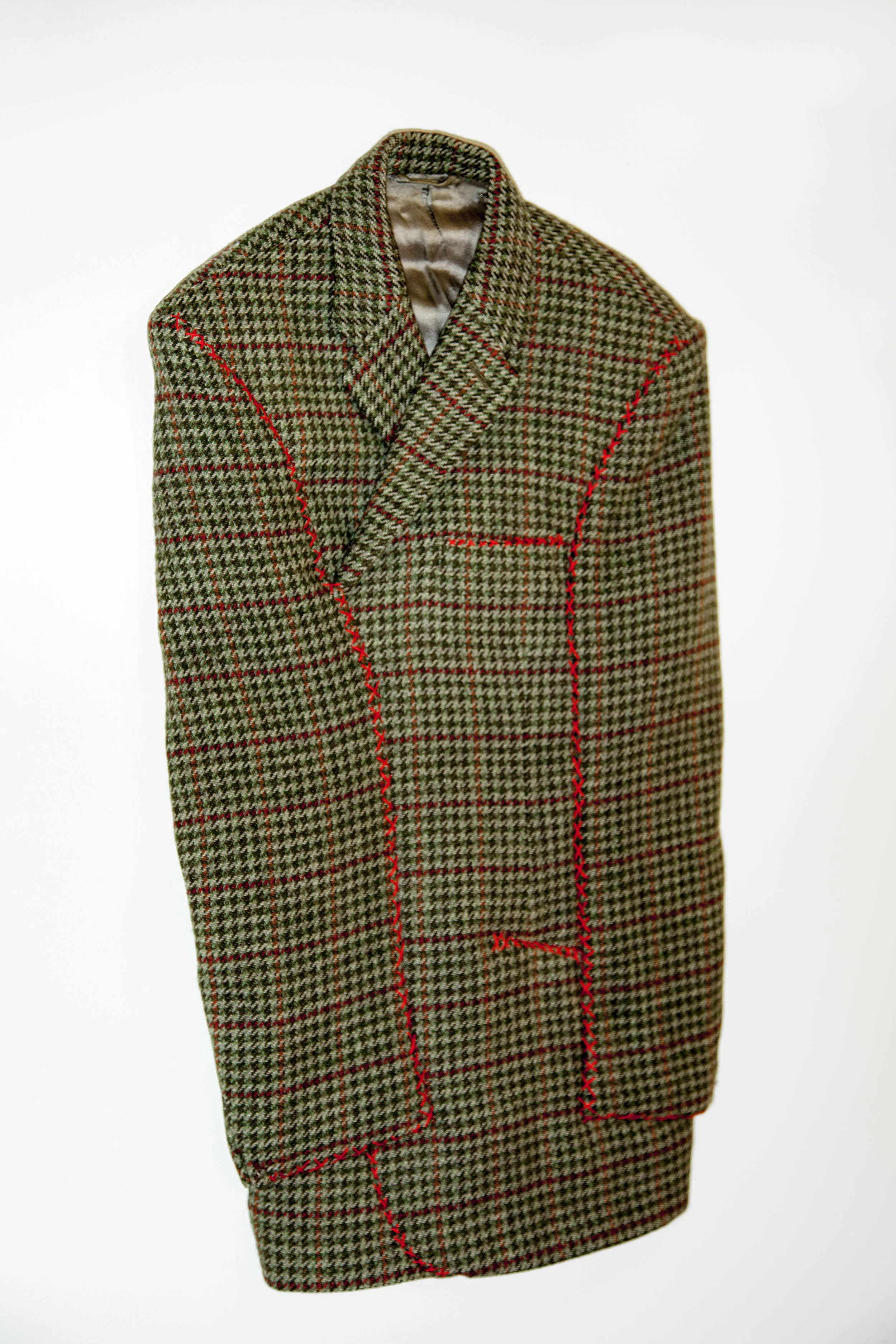 A Person Who Is Not A Cowboy, 2015, Houndstooth jacket, cotton thread 36 x 12 x 2.5