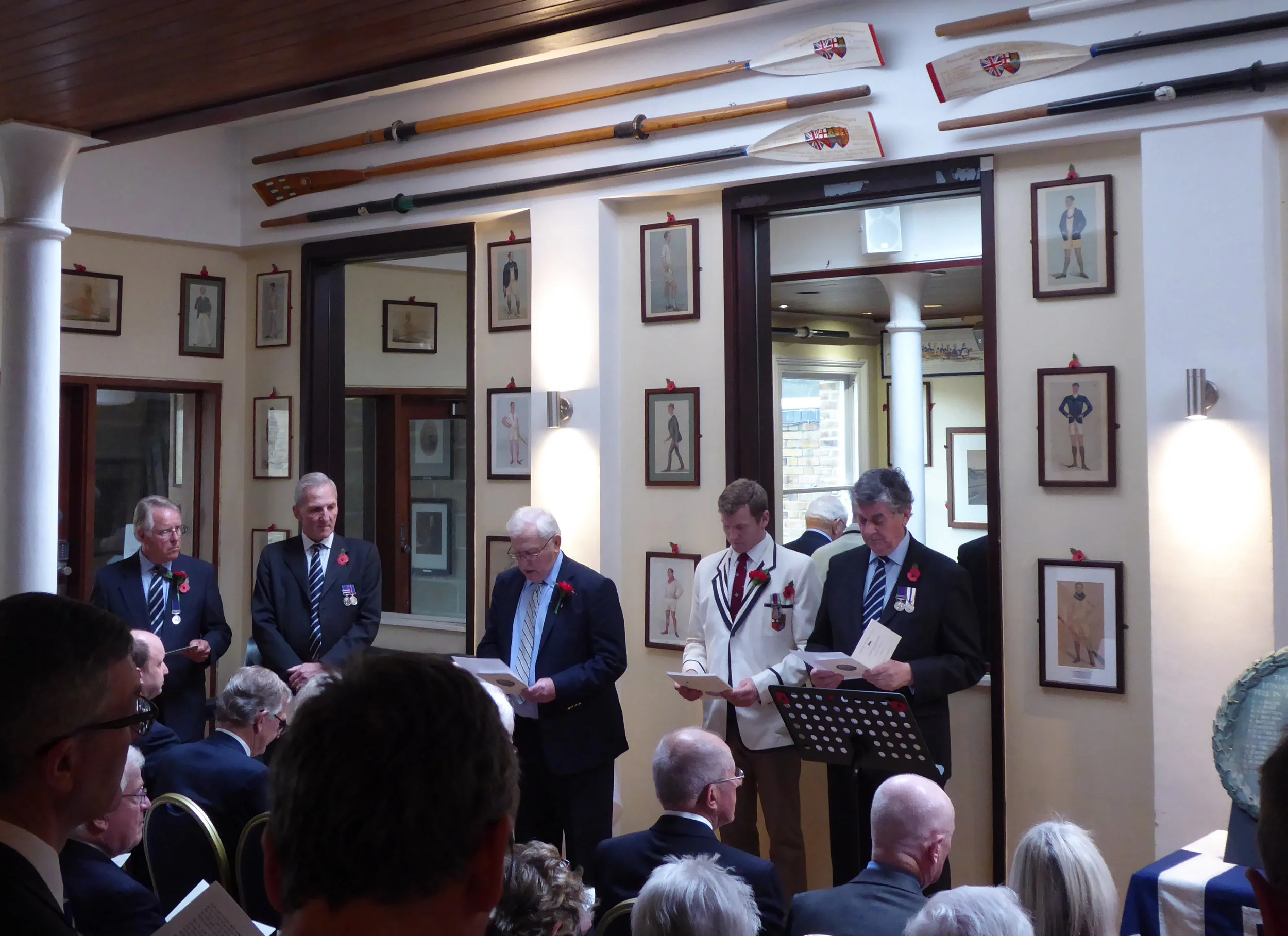 Readers of the names of the 50 fallen (L to R) - Robin Cameron Cooper; Alan Foster; Peter Fraser; Tim Grant (Captain); Iain Reid. The re-dedicated war memorial tablet is on the right.