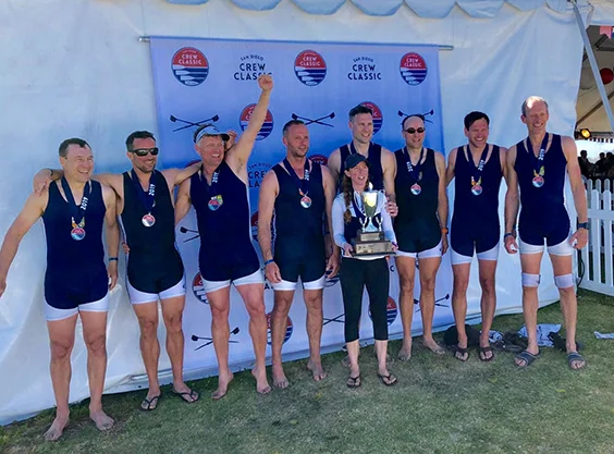 Masters D event prize-giving, left to right: Stewart Harries, Duncan McLellan, Ralph Humphrey, Shaun Martin, Henry Hering, Adrian Theed, Marc Schneider and Peter Jacobs, with Mary Whipple at the front holding the trophy.