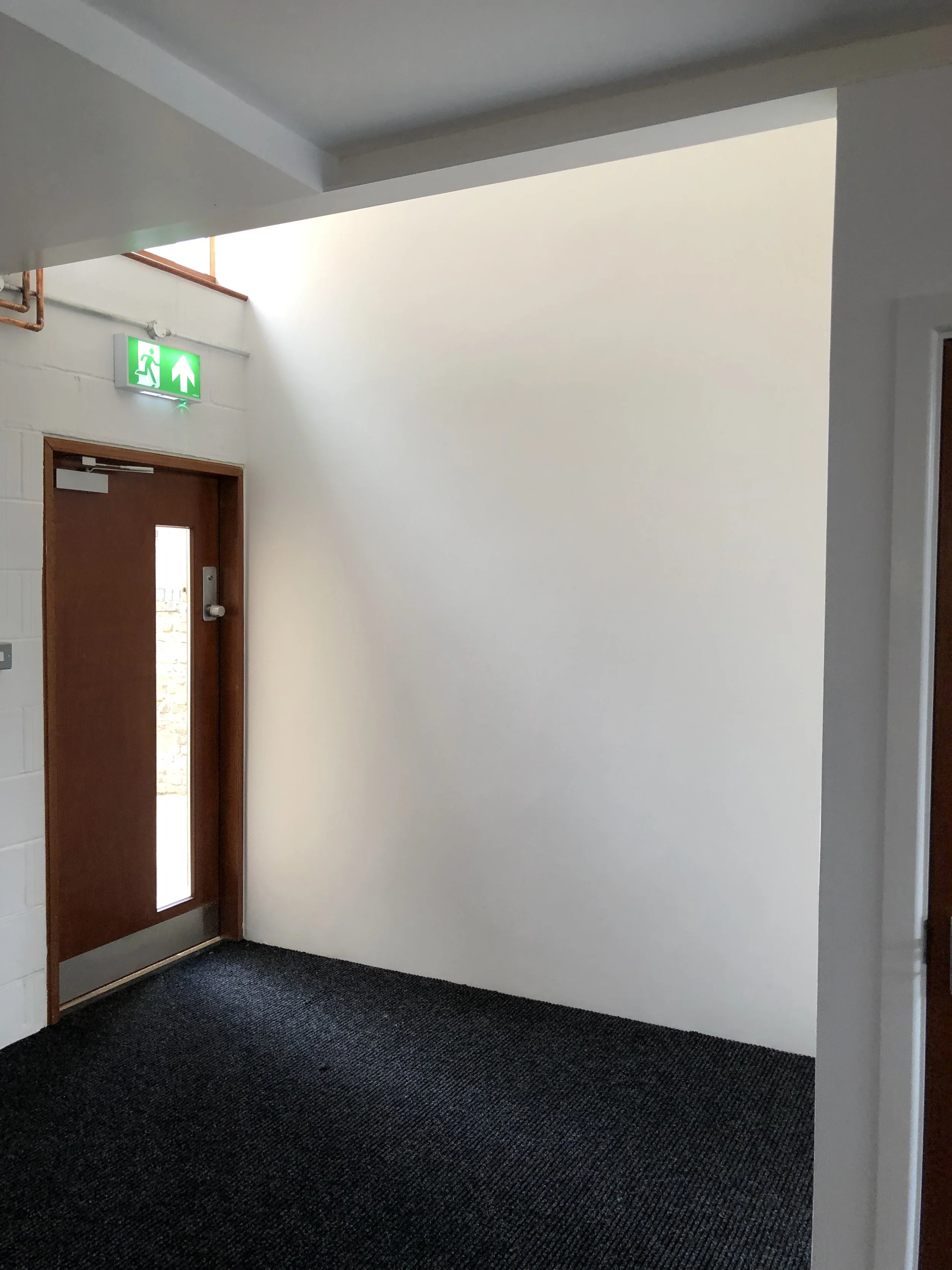 The side wall of the new entrance awaiting a very special montage…