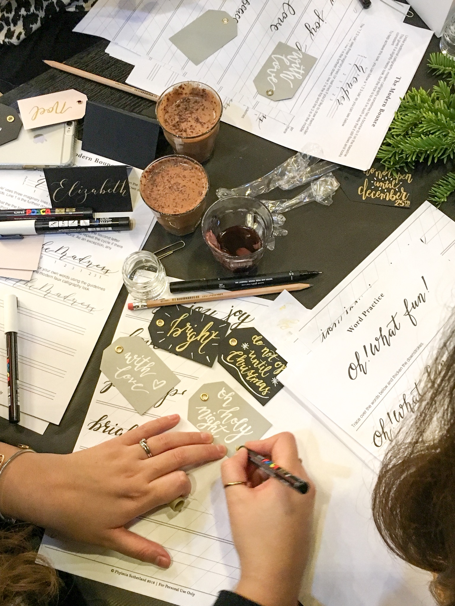 Hand lettered Christmas gift tags during my faux calligraphy class in Leeds