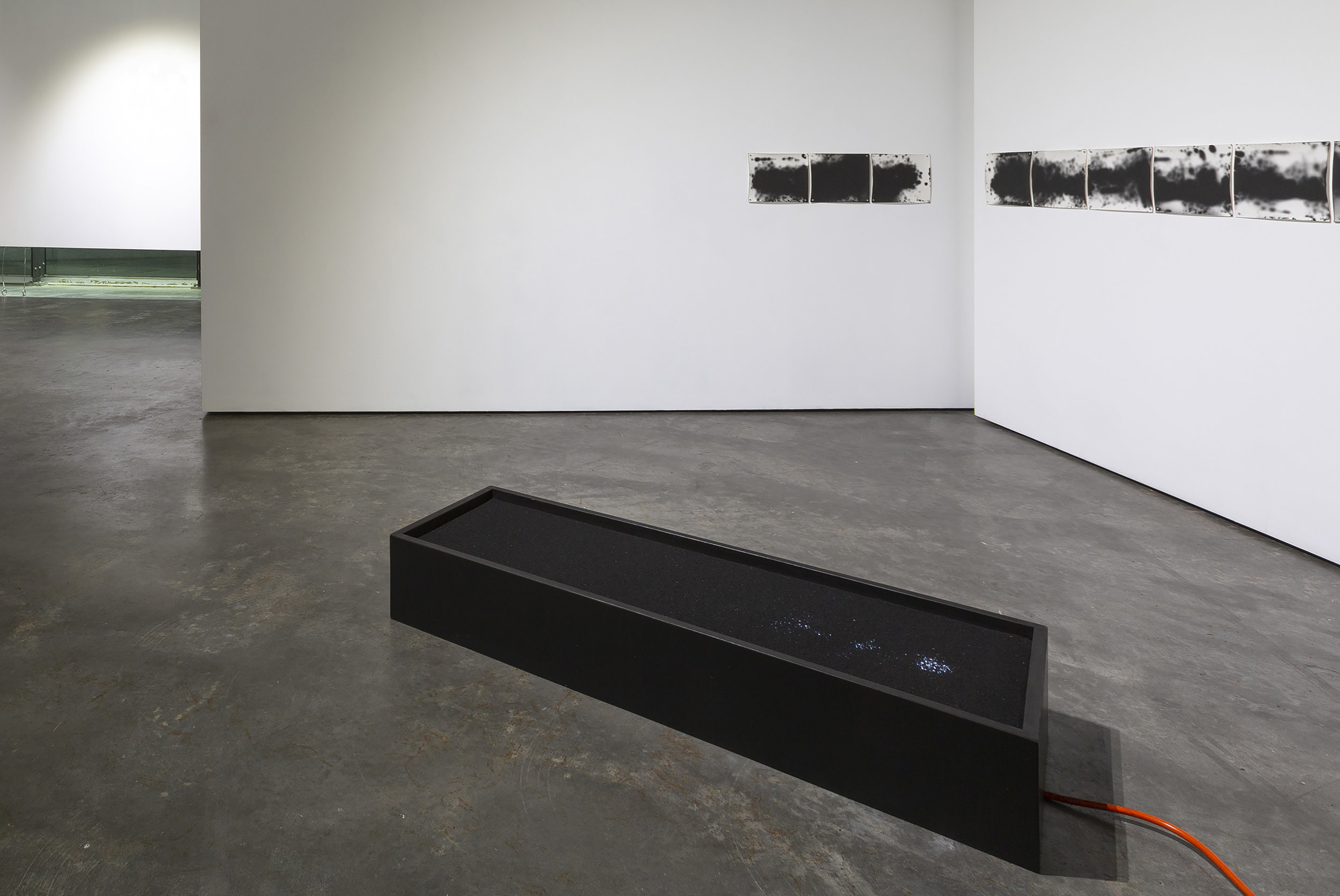 Survey 2019, Animated lightbox - LED lights, acrylic, custom frame and coal dust Blind Survey, Unique silver gelatin photograms Survey and Blind Survey were exhibited at Verge Gallery in April 2019 as part of the exhibition, Resurfaced Geographies, with Izabela Pluta and Ellen Dahl. These works responded to the idea of landscape photography, with the particular landscape that I responded to being the the Fife coast in Scotland, formerly the site of the Michael Colliery, a former coal mining site that my Grandfather worked in during the post war years. The landscape as it was at the time of mining is no longer, the architecture of the tunnels underneath the feet still in existence, but hidden from view. I approached this site seeking some visual clues to what had gone before, scanning the ground like a survey. the bosy of work ties into my enduring interest between what can be seen and what cannot.